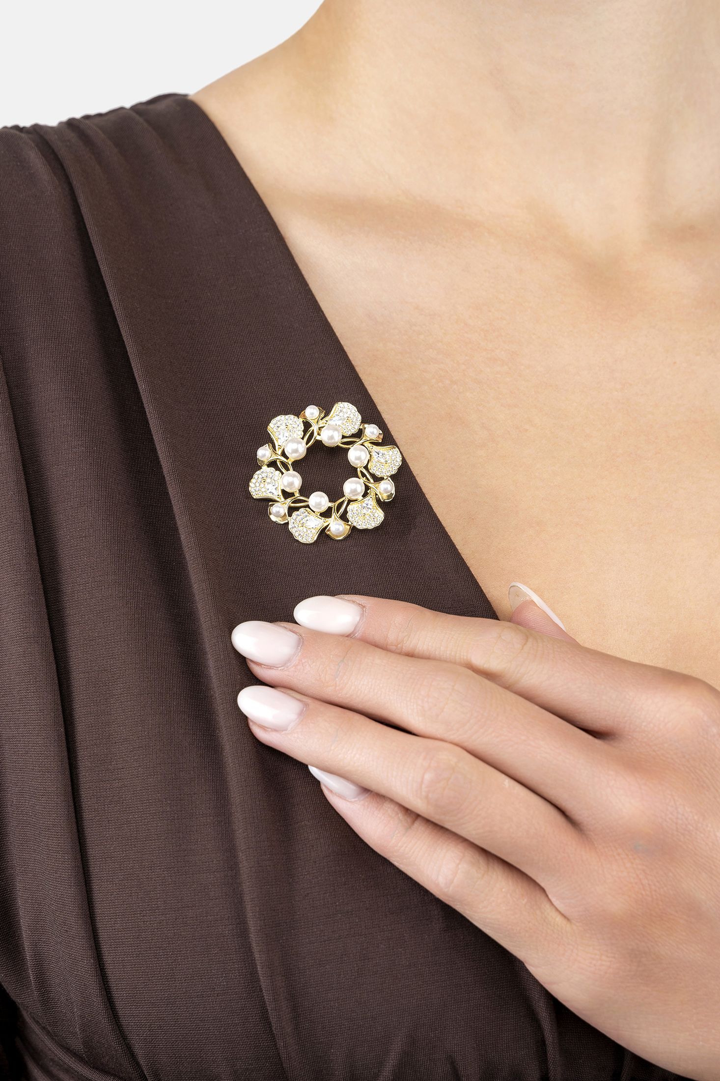 Angled view of Ginkgo Leaf And Pearl Wreath Brooch Gold, showing leaf design, pearl detailing, gold finish and the jewellery profile.