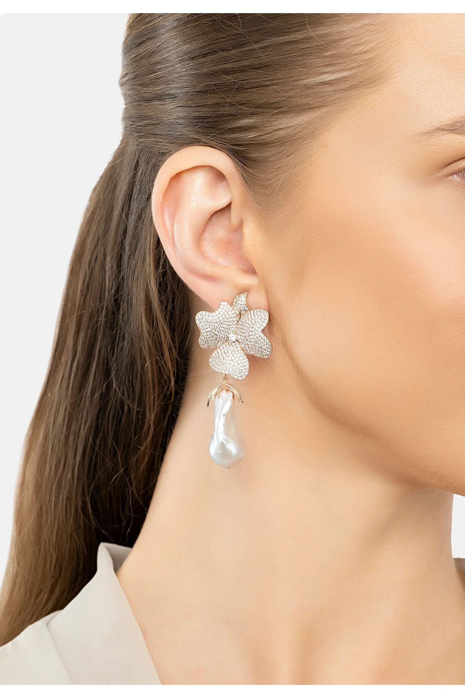 The earring worn by a model.