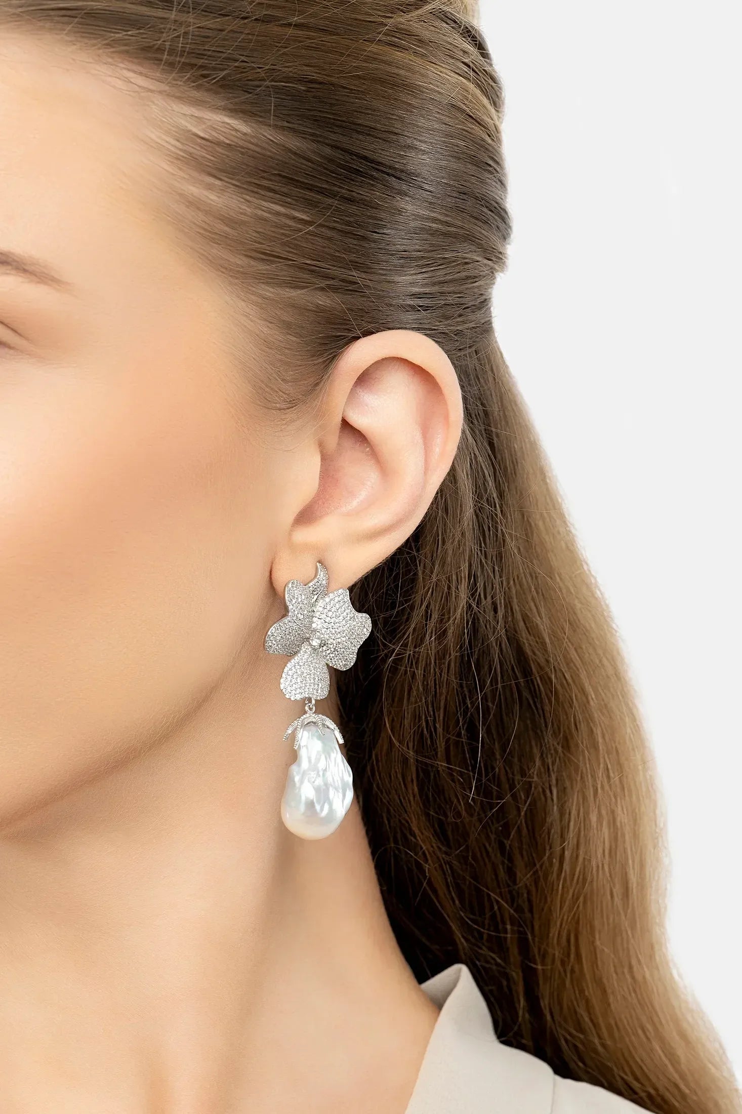 The earring worn by a model.