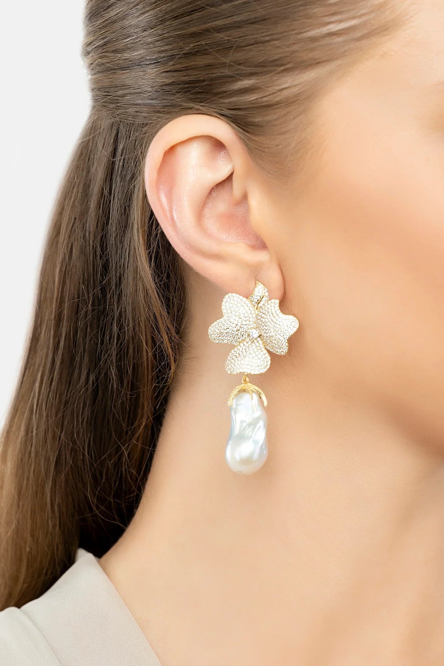 The earring worn by a model.