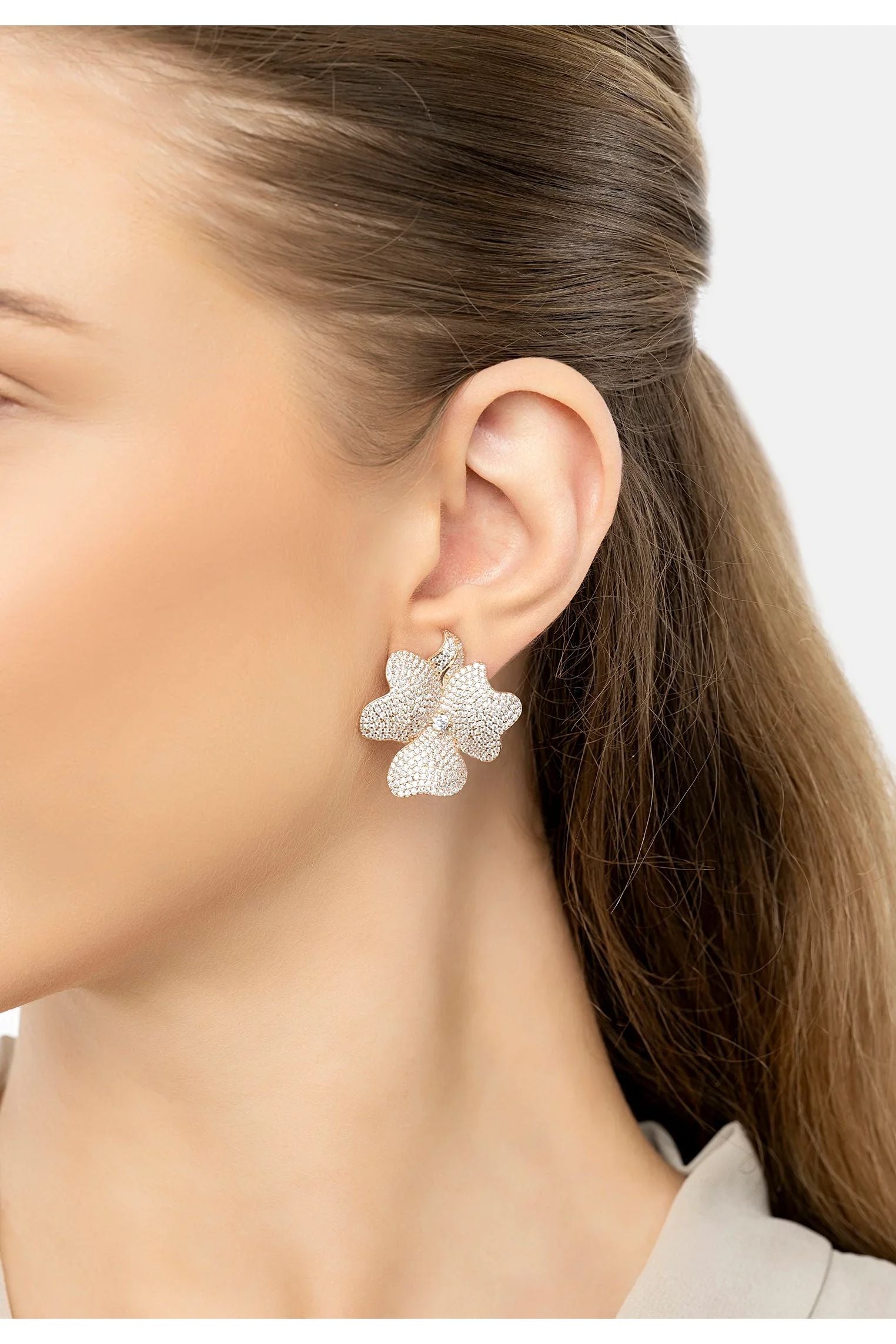 The earring worn by a model.