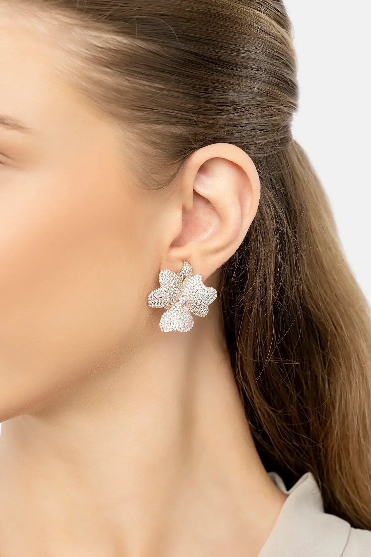 The earring worn by a model.