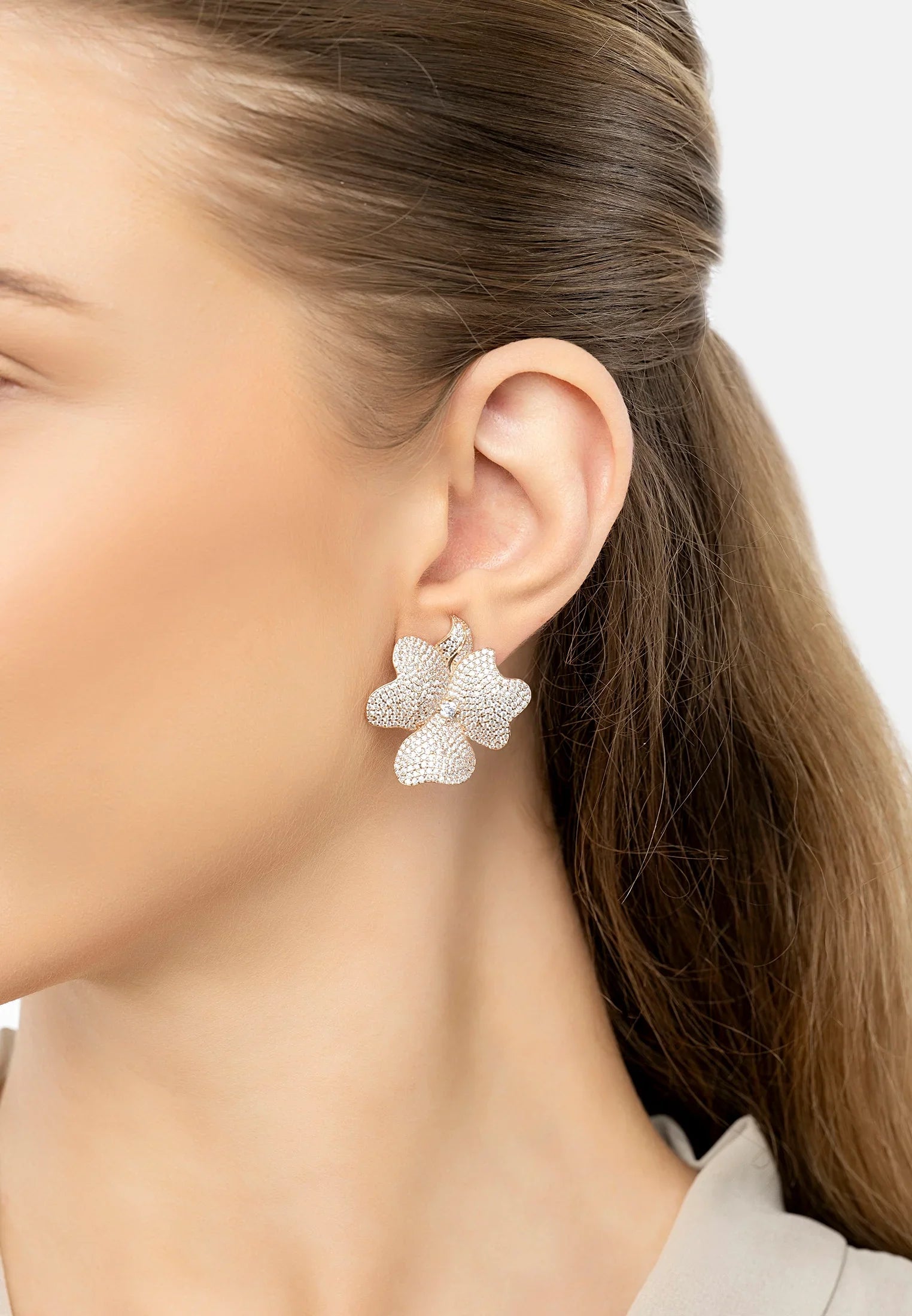 The earring worn by a model.
