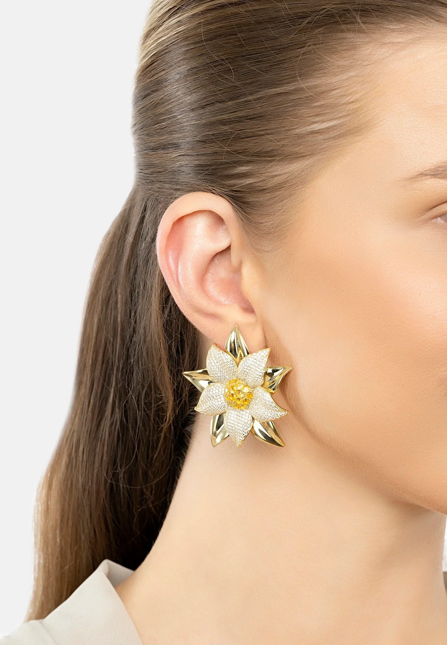 The earring worn by a model.