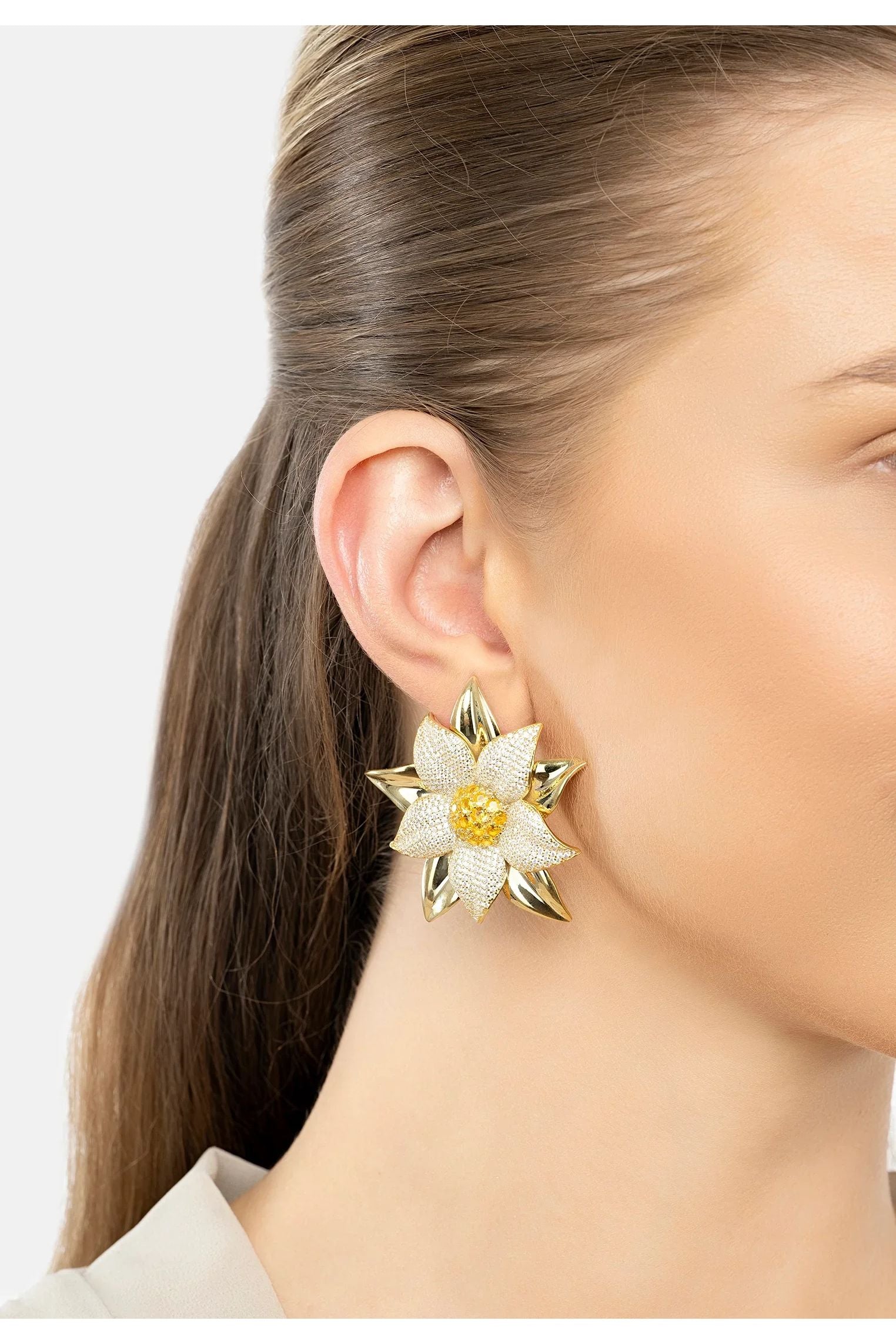 The earring worn by a model.