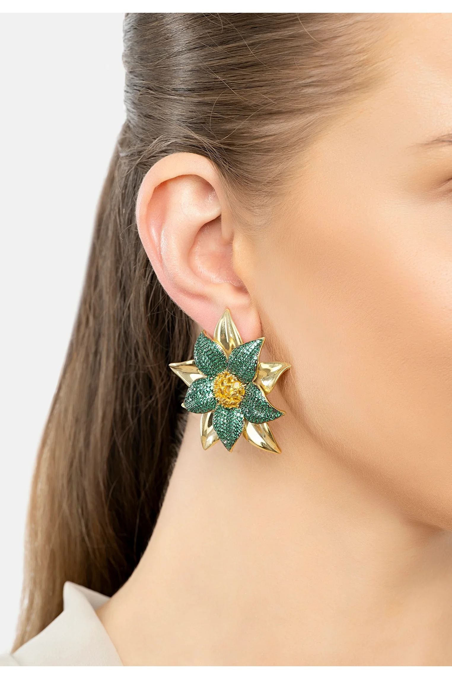 The earring worn by a model.