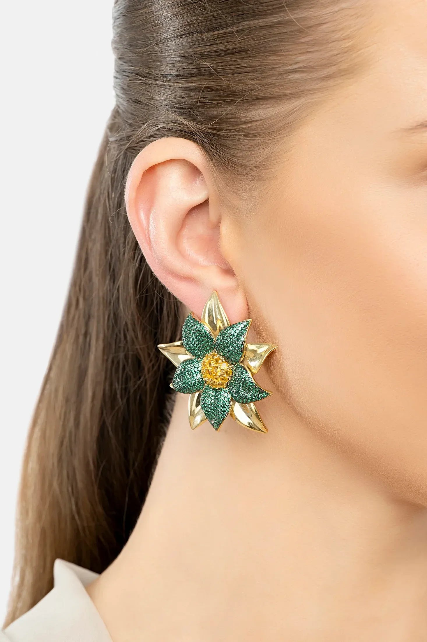 The earring worn by a model.