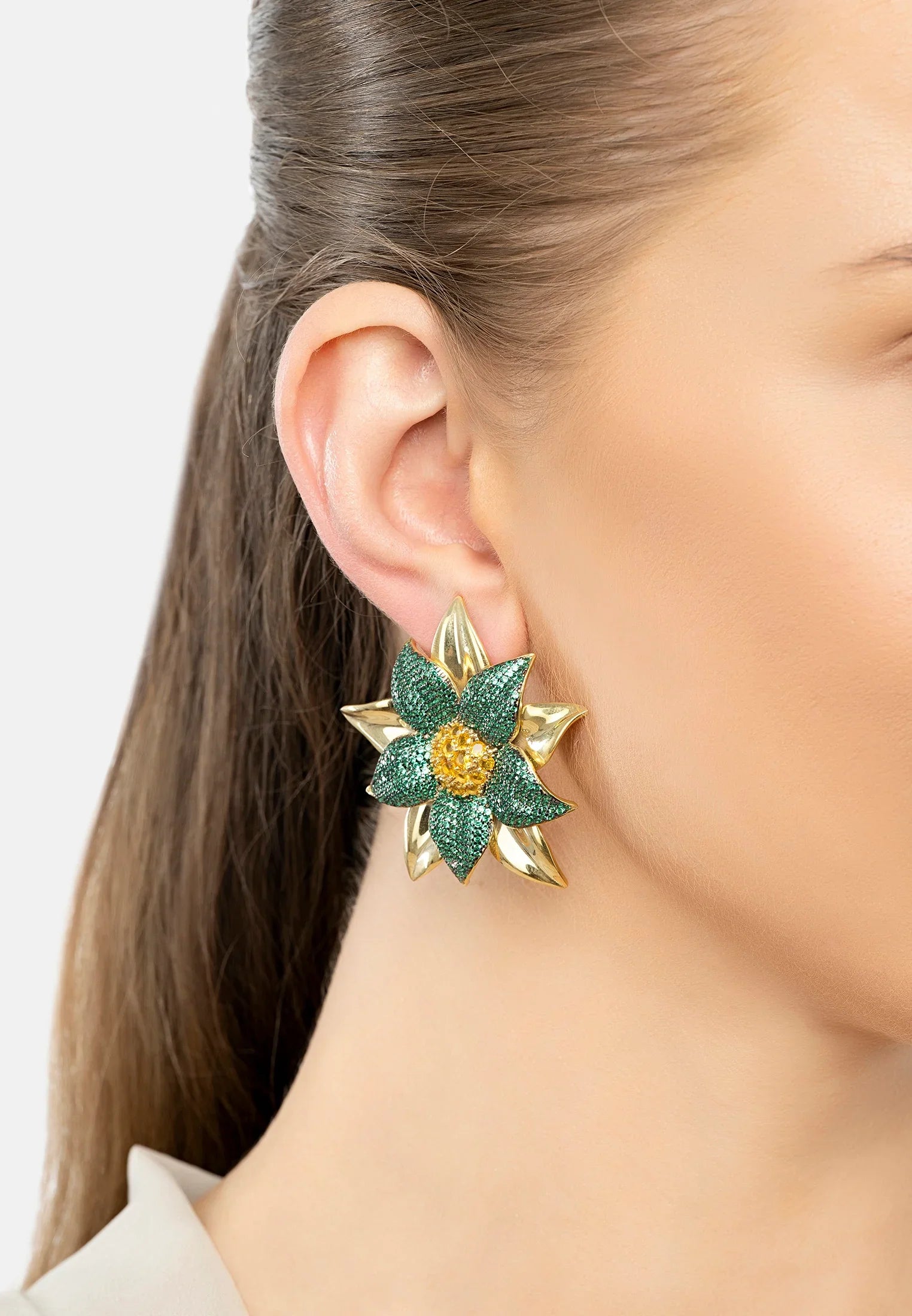The earring worn by a model.
