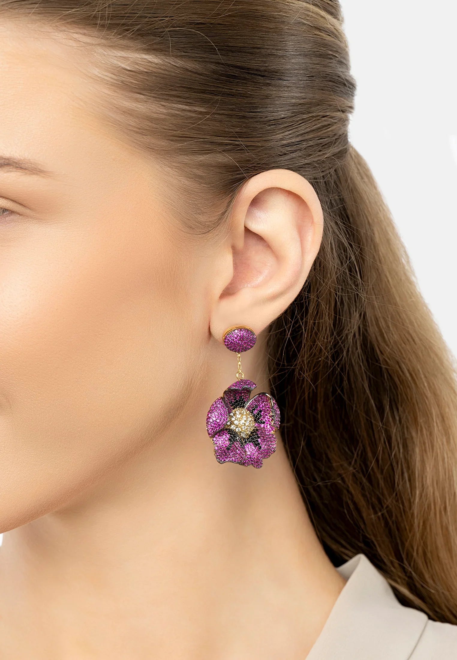 The earring worn by a model.