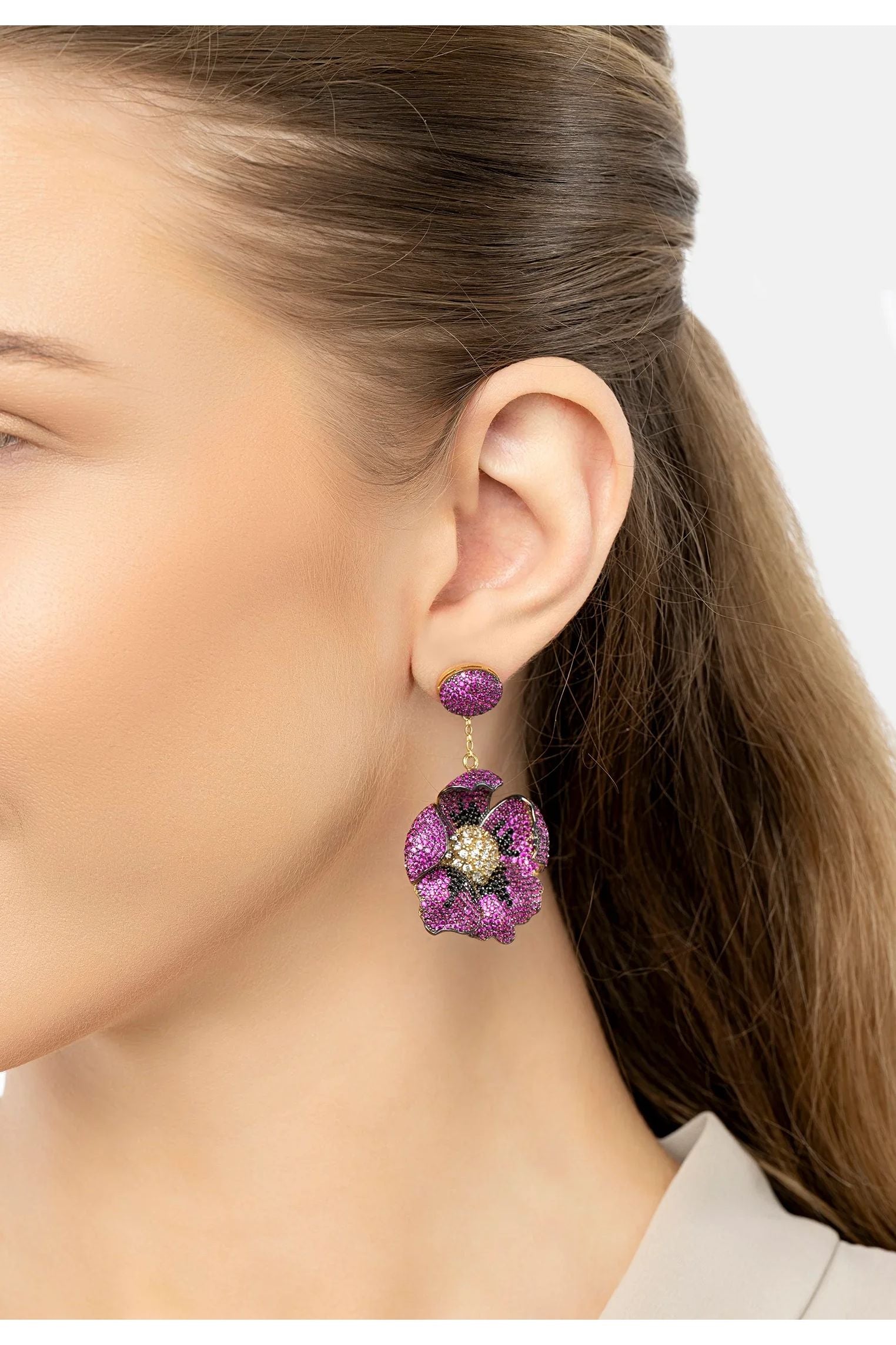 The earring worn by a model.