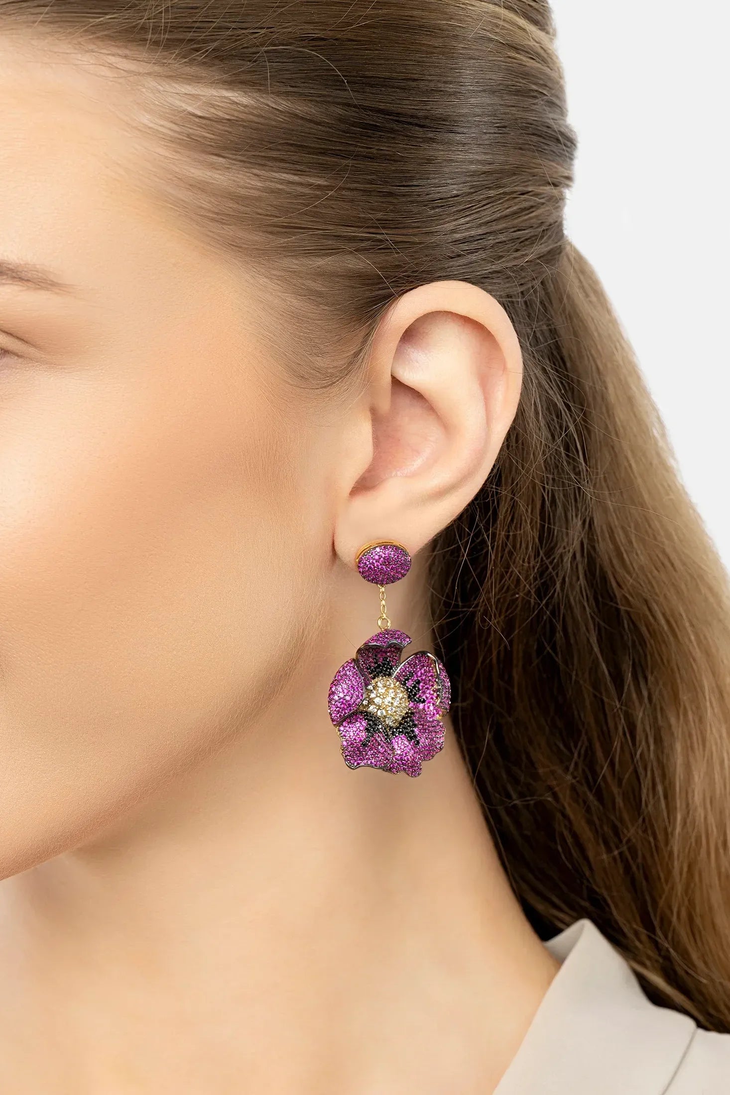 The earring worn by a model.