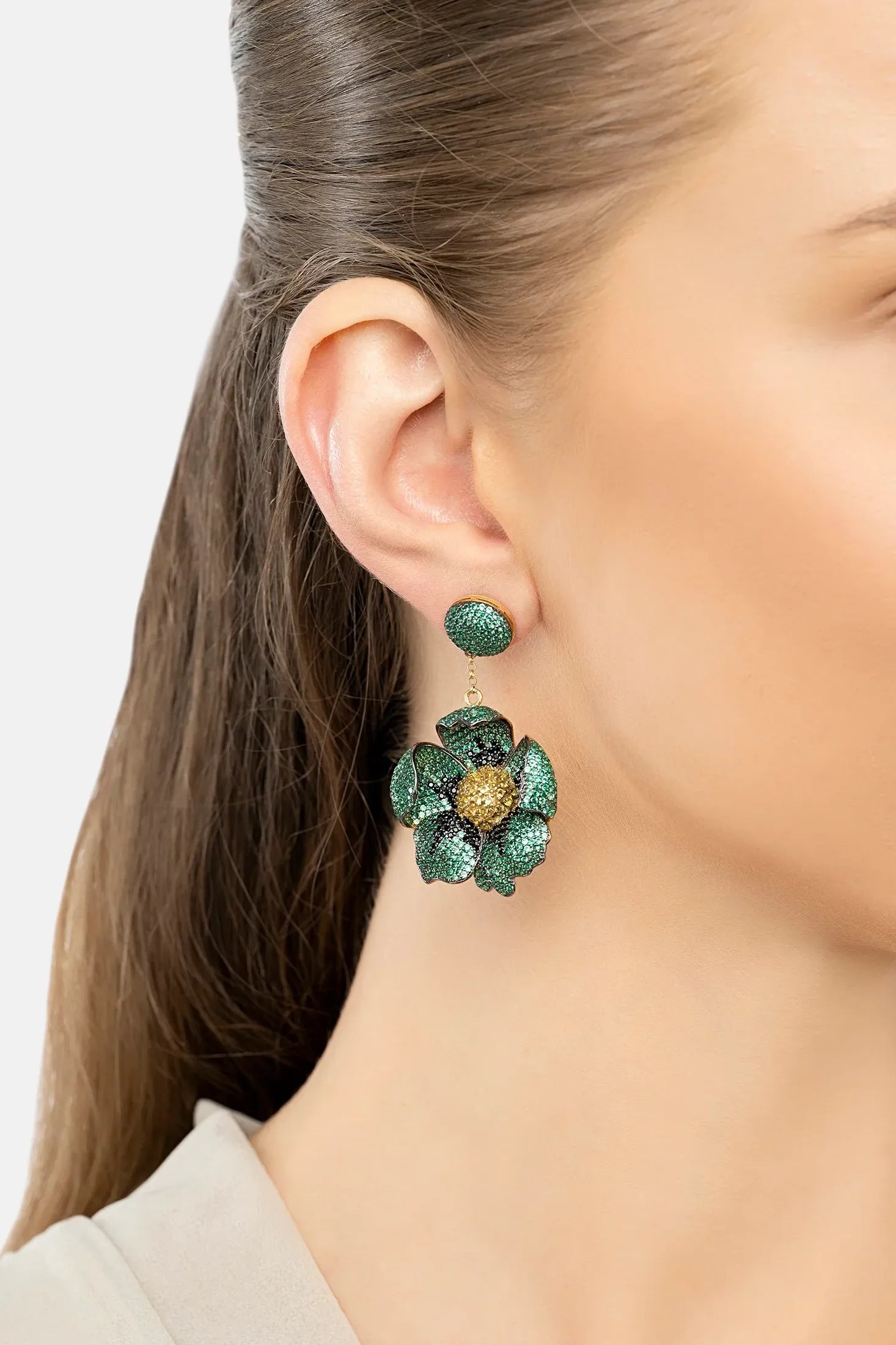 The earring worn by a model.