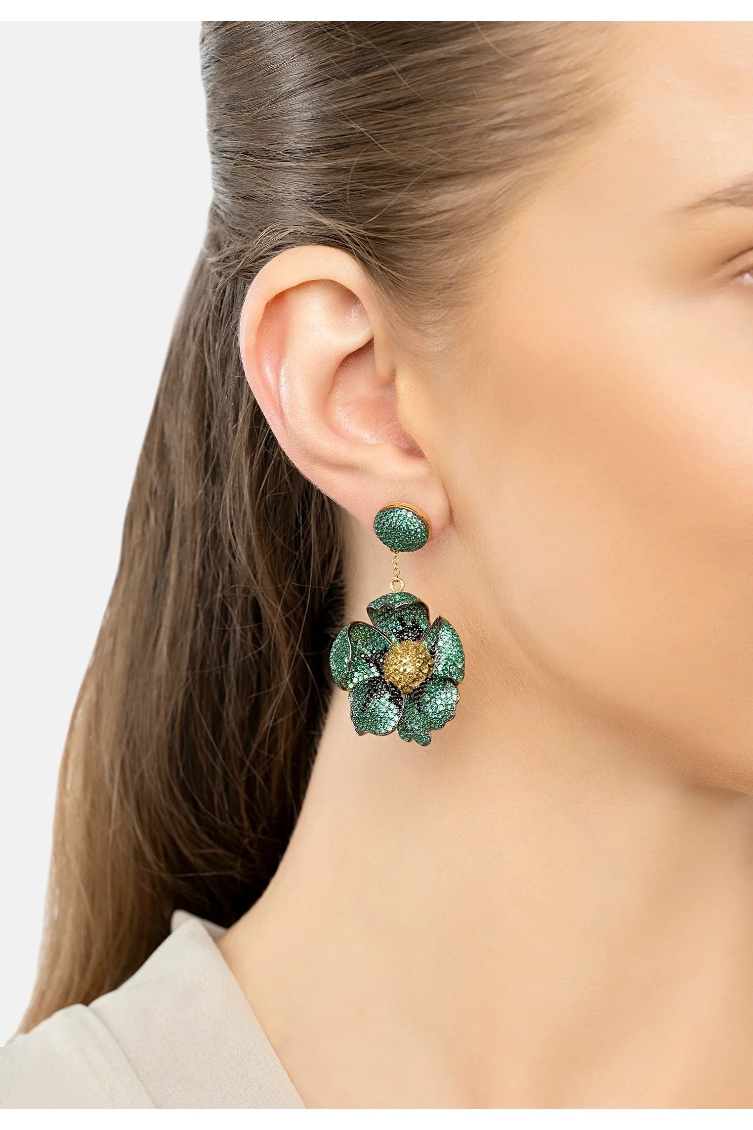 The earring worn by a model.