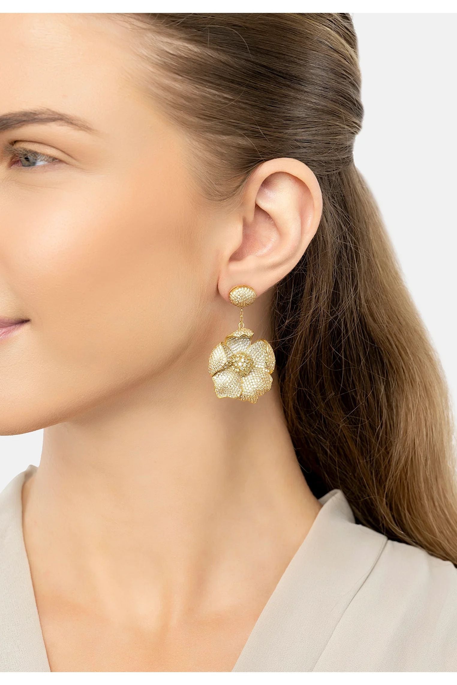 The earring worn by a model.