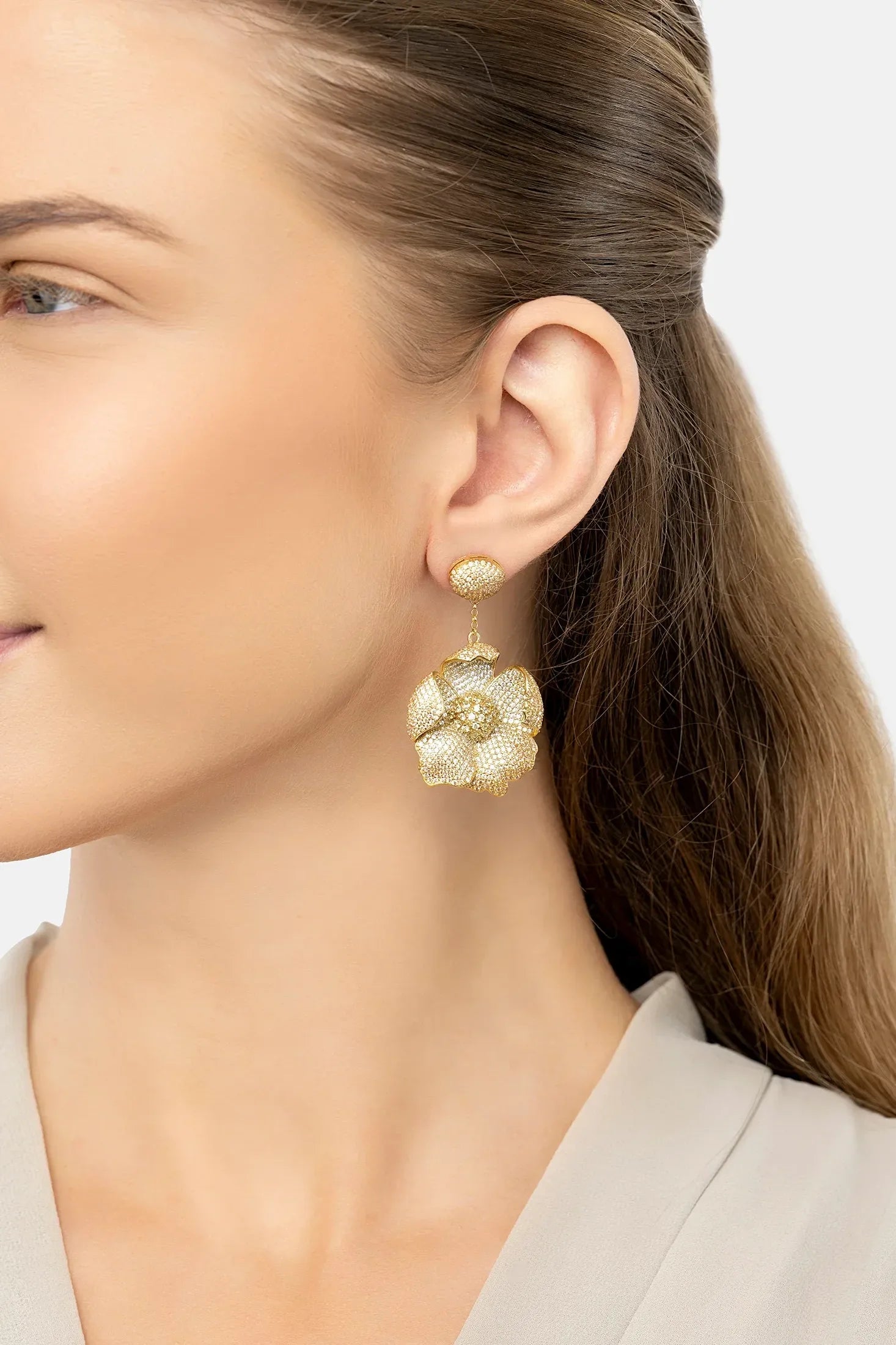 The earring worn by a model.