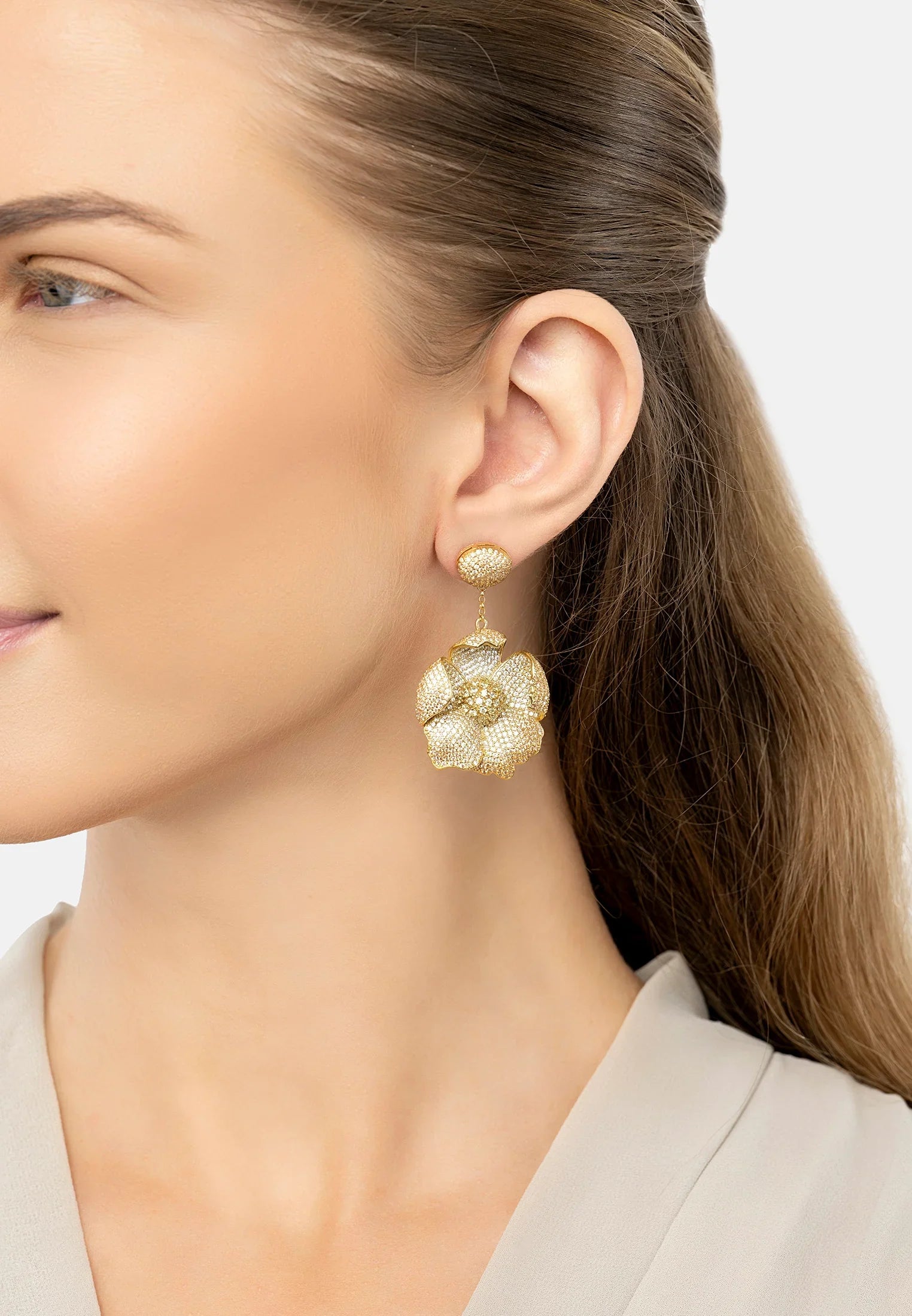 The earring worn by a model.