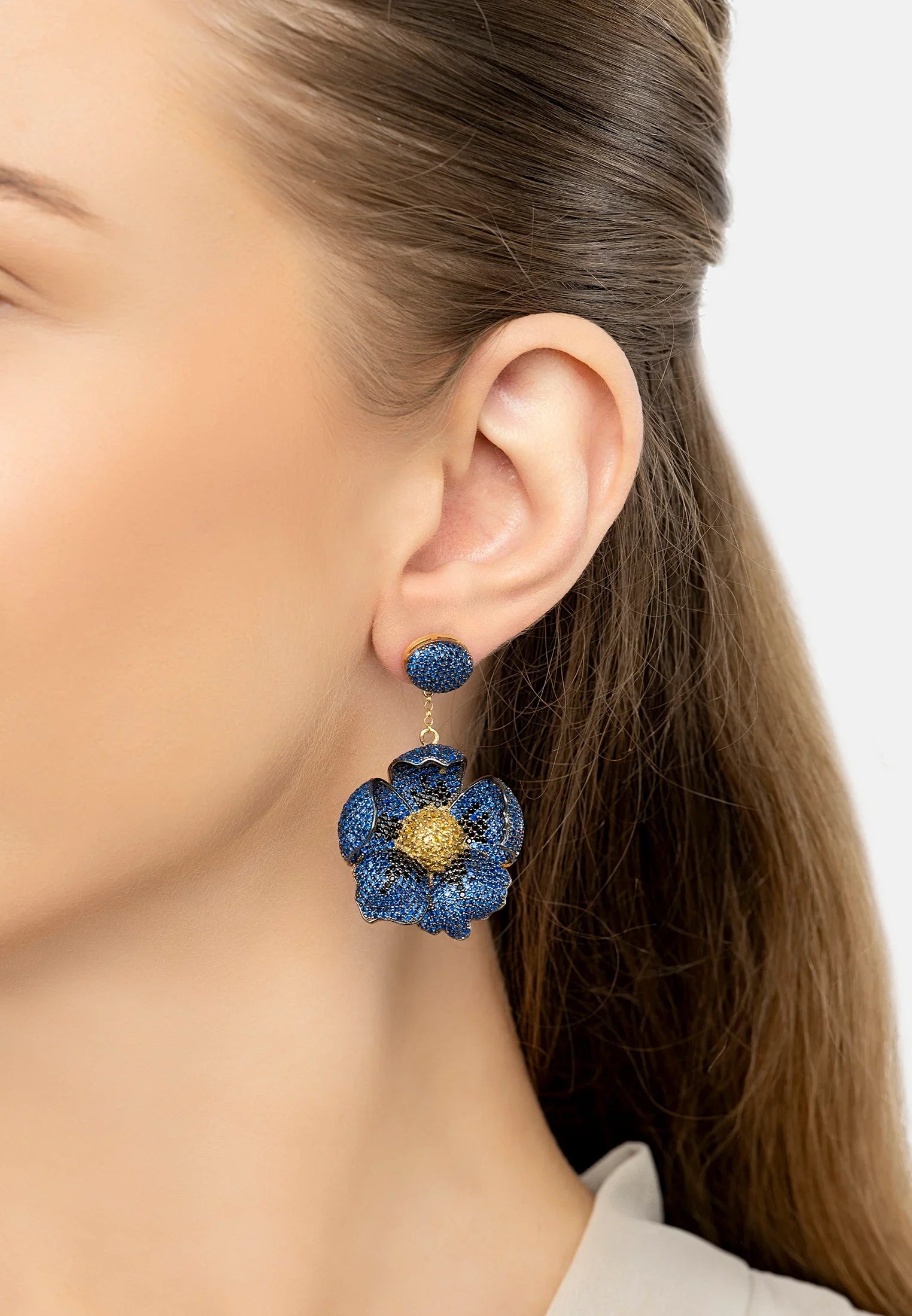 The earring worn by a model.