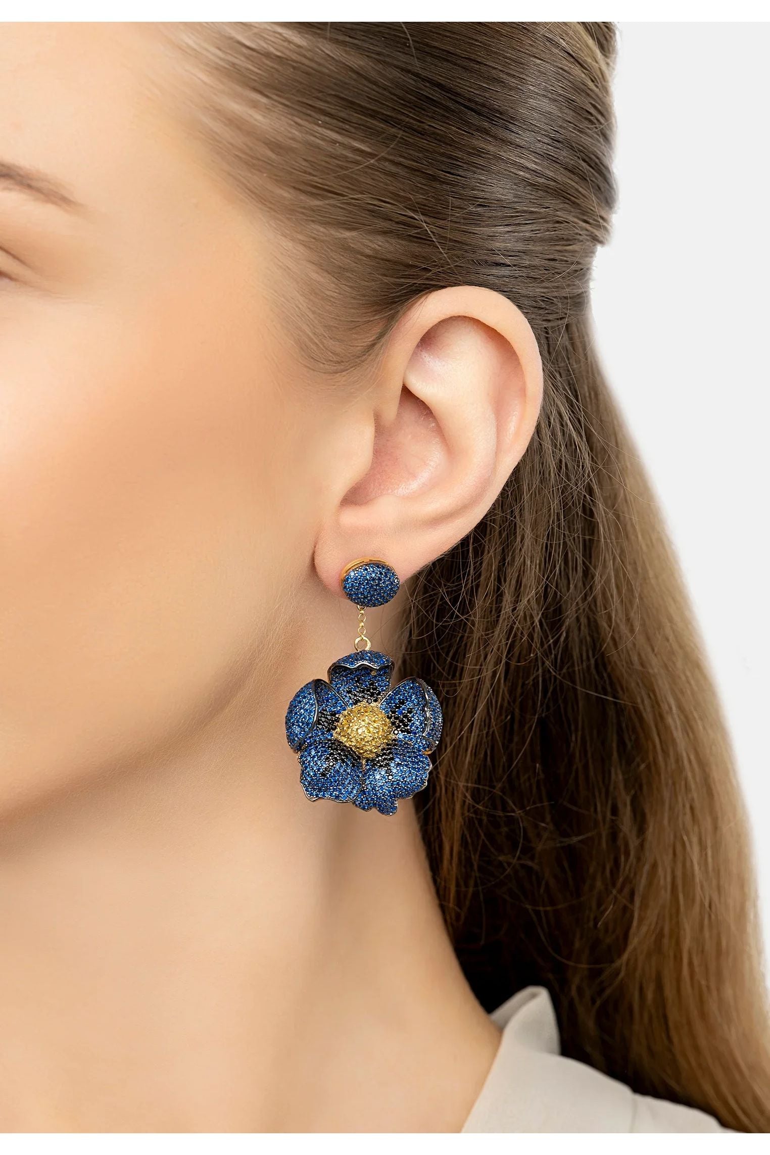 The earring worn by a model.