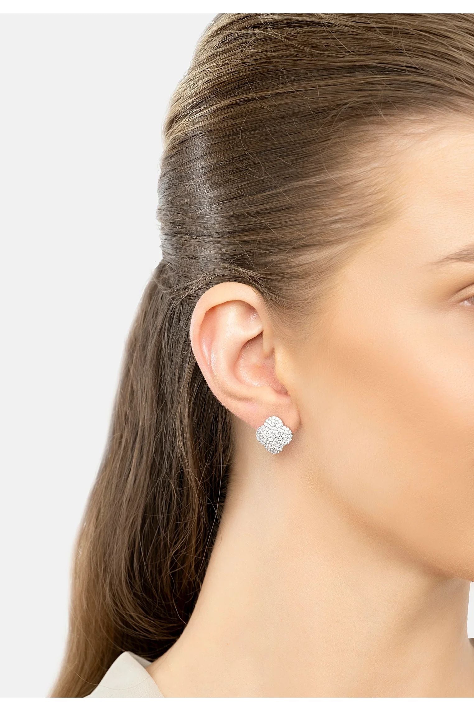 The earring worn by a model.