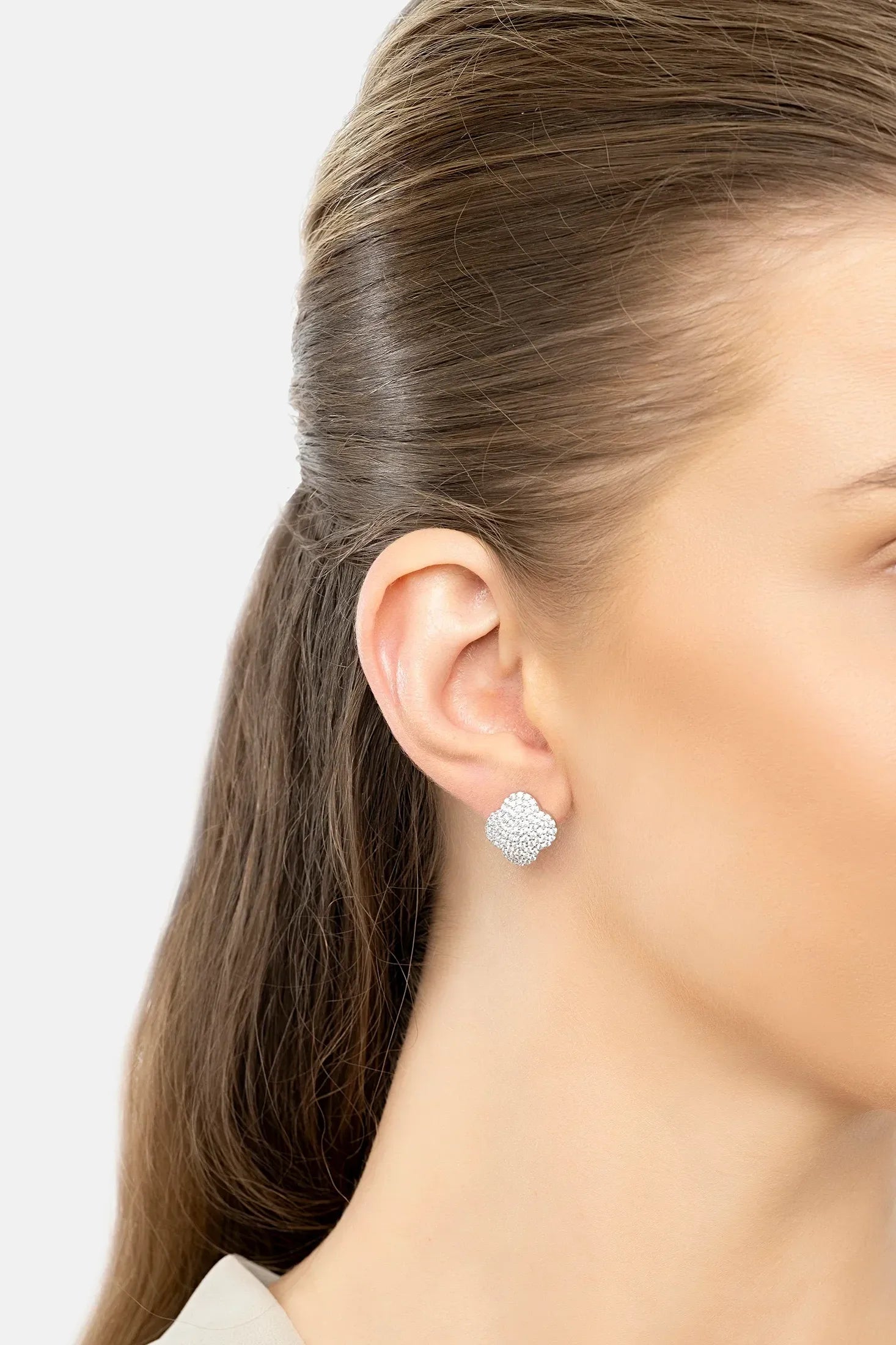 The earring worn by a model.
