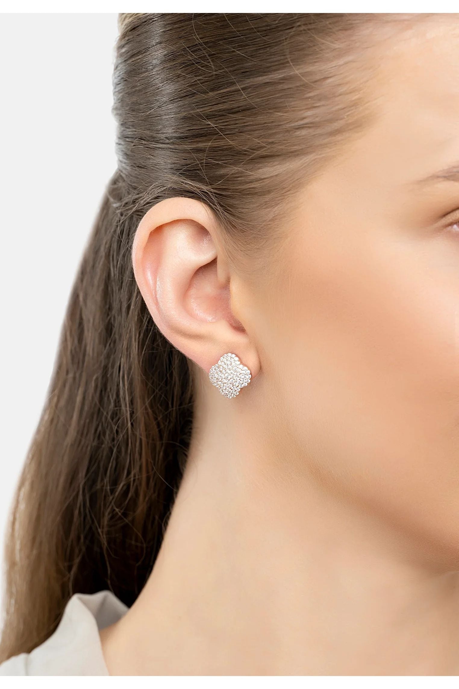 The earring worn by a model.