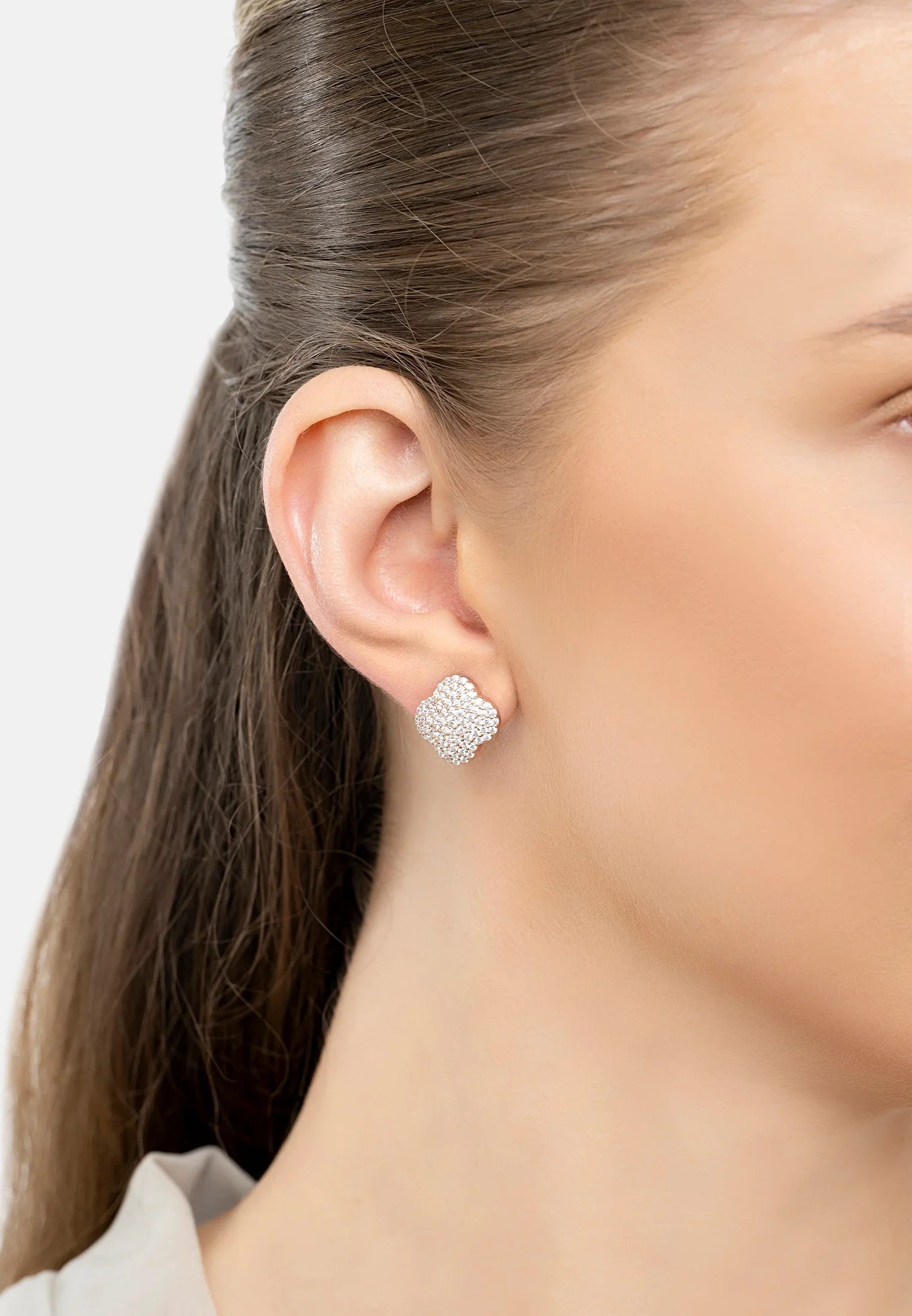 The earring worn by a model.