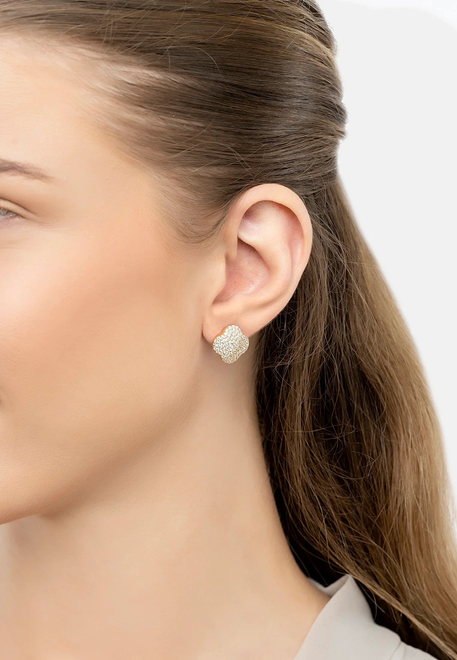 The earring worn by a model.