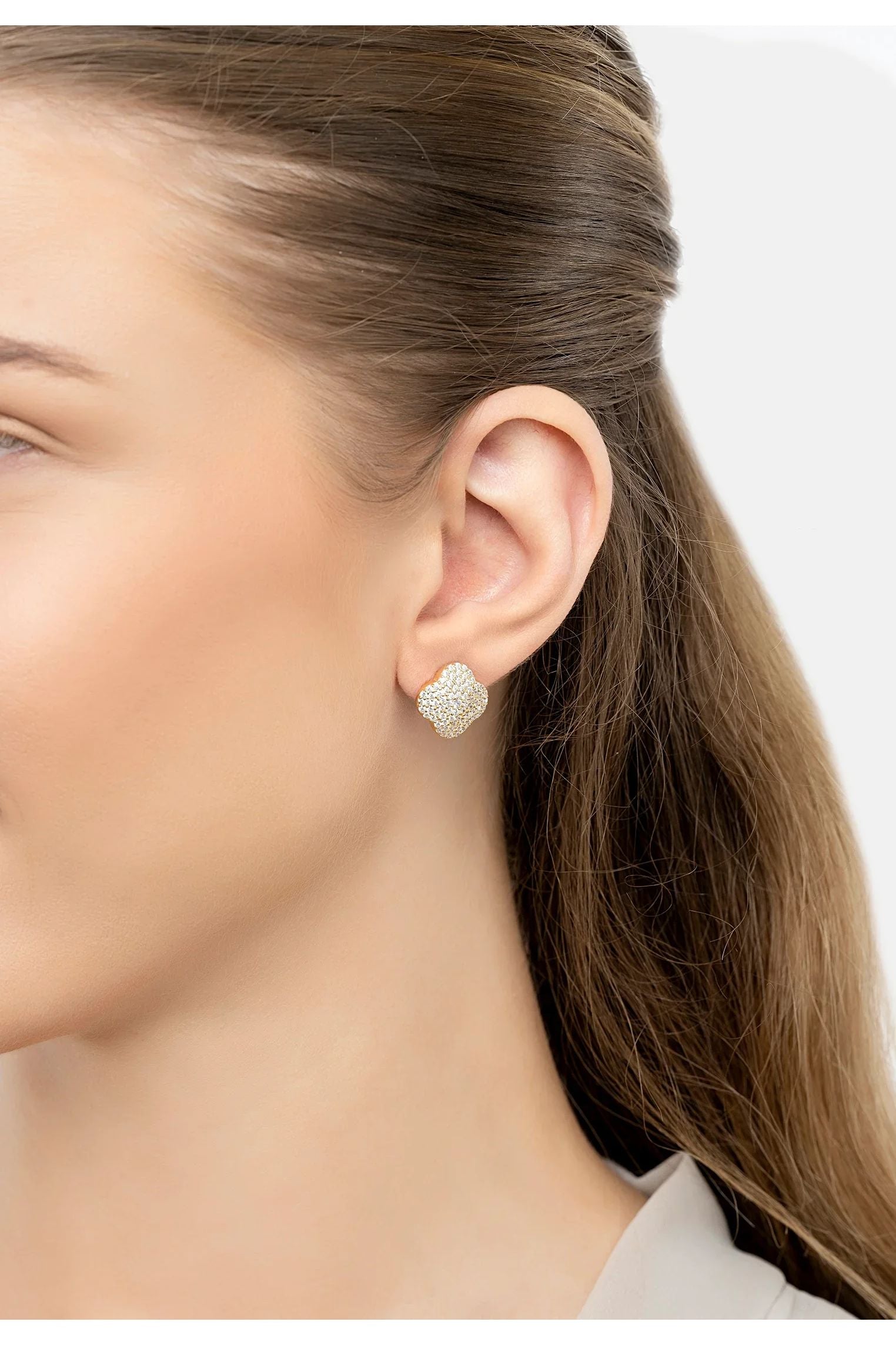 The earring worn by a model.