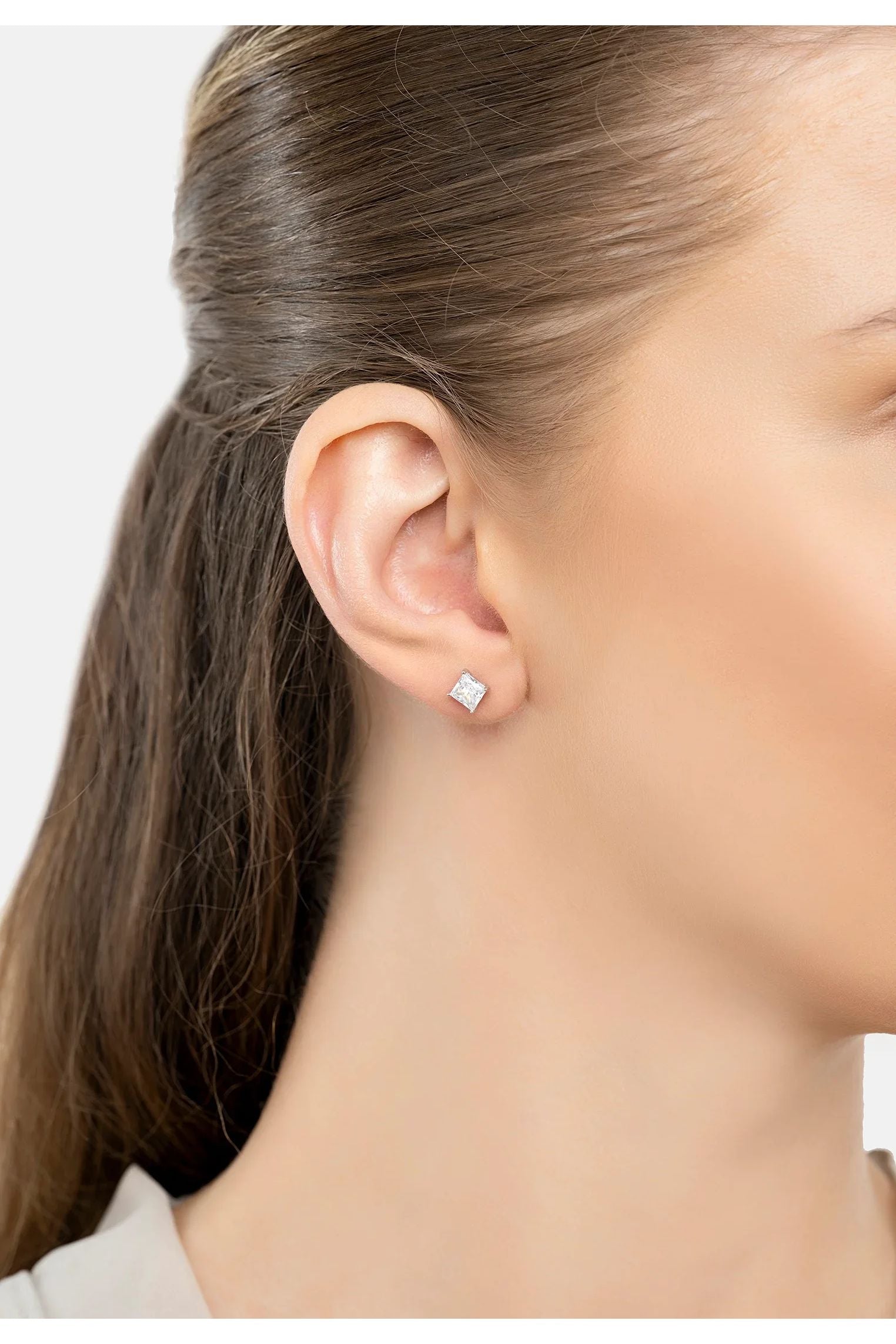 The earring worn by a model.