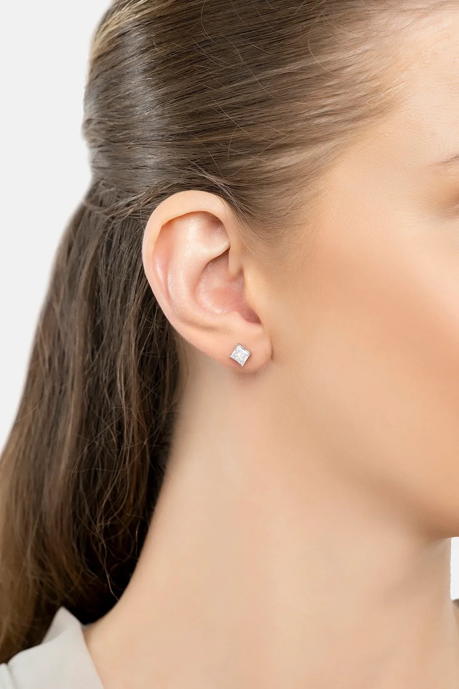The earring worn by a model.