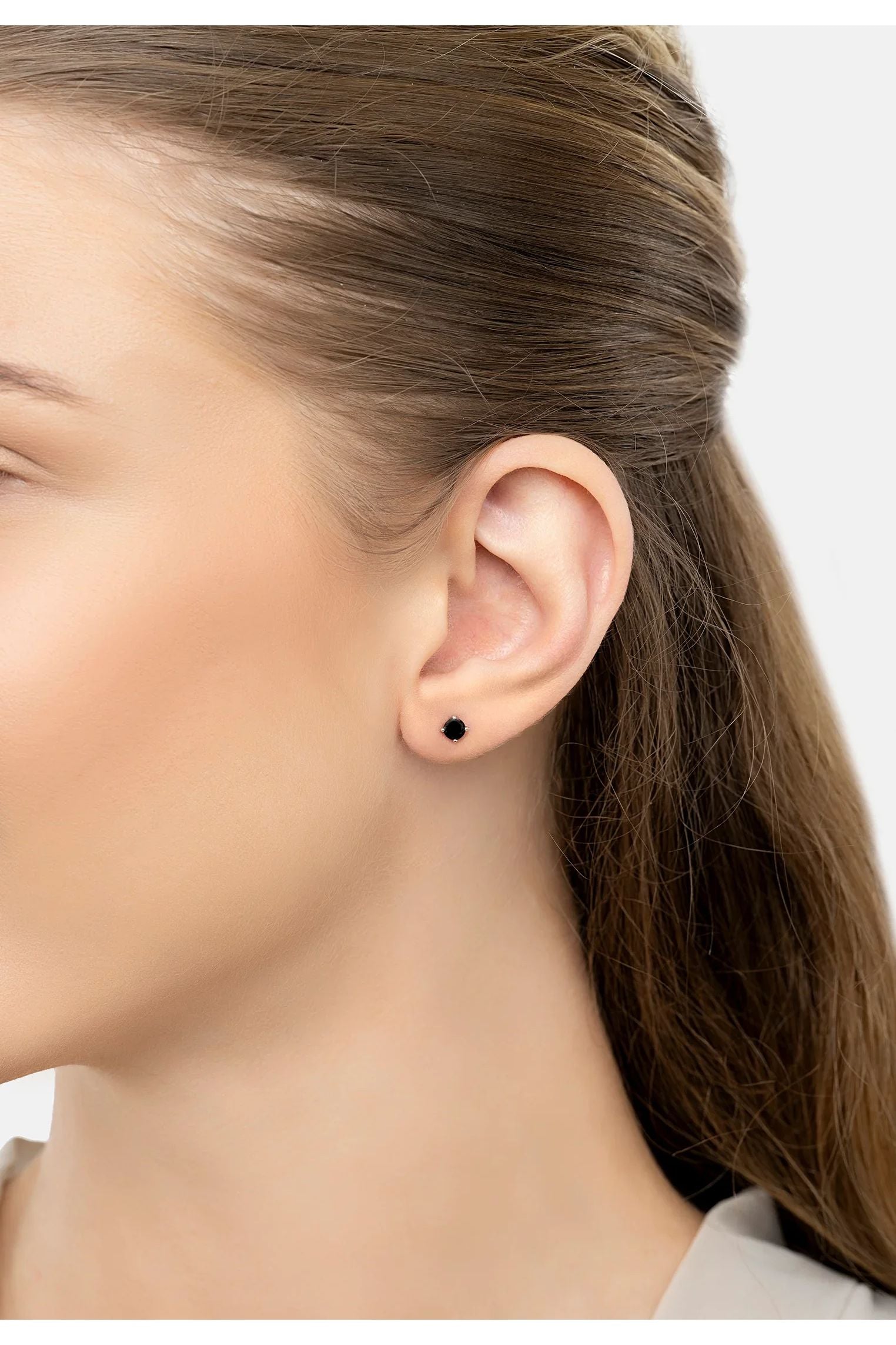 The earring worn by a model.