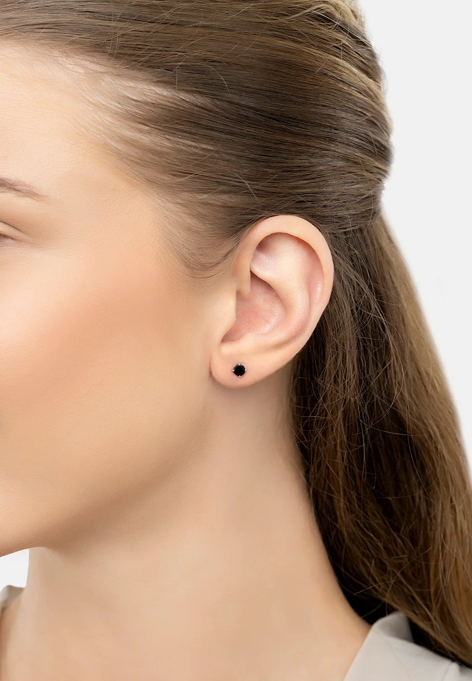 The earring worn by a model.