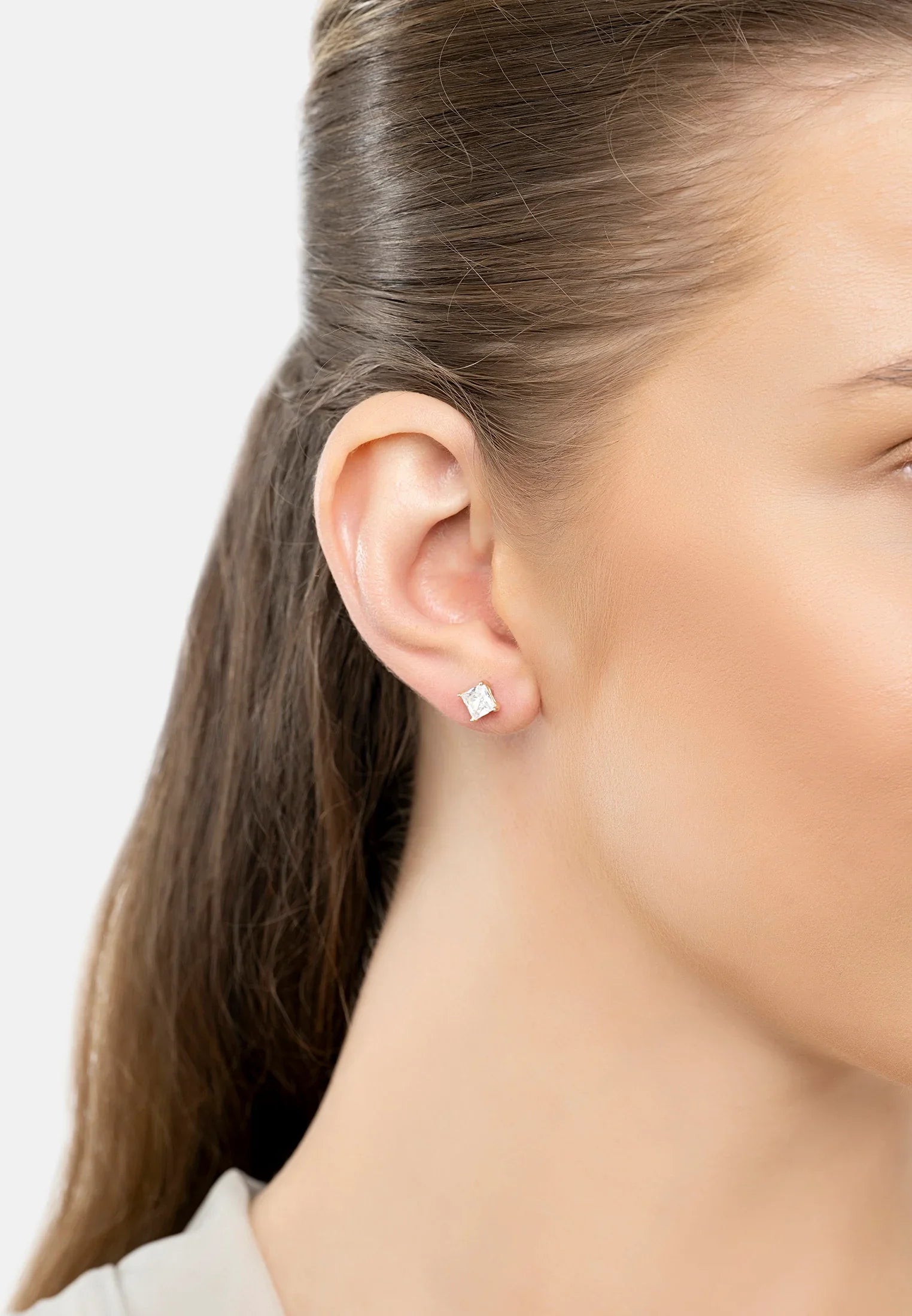 The earring worn by a model.