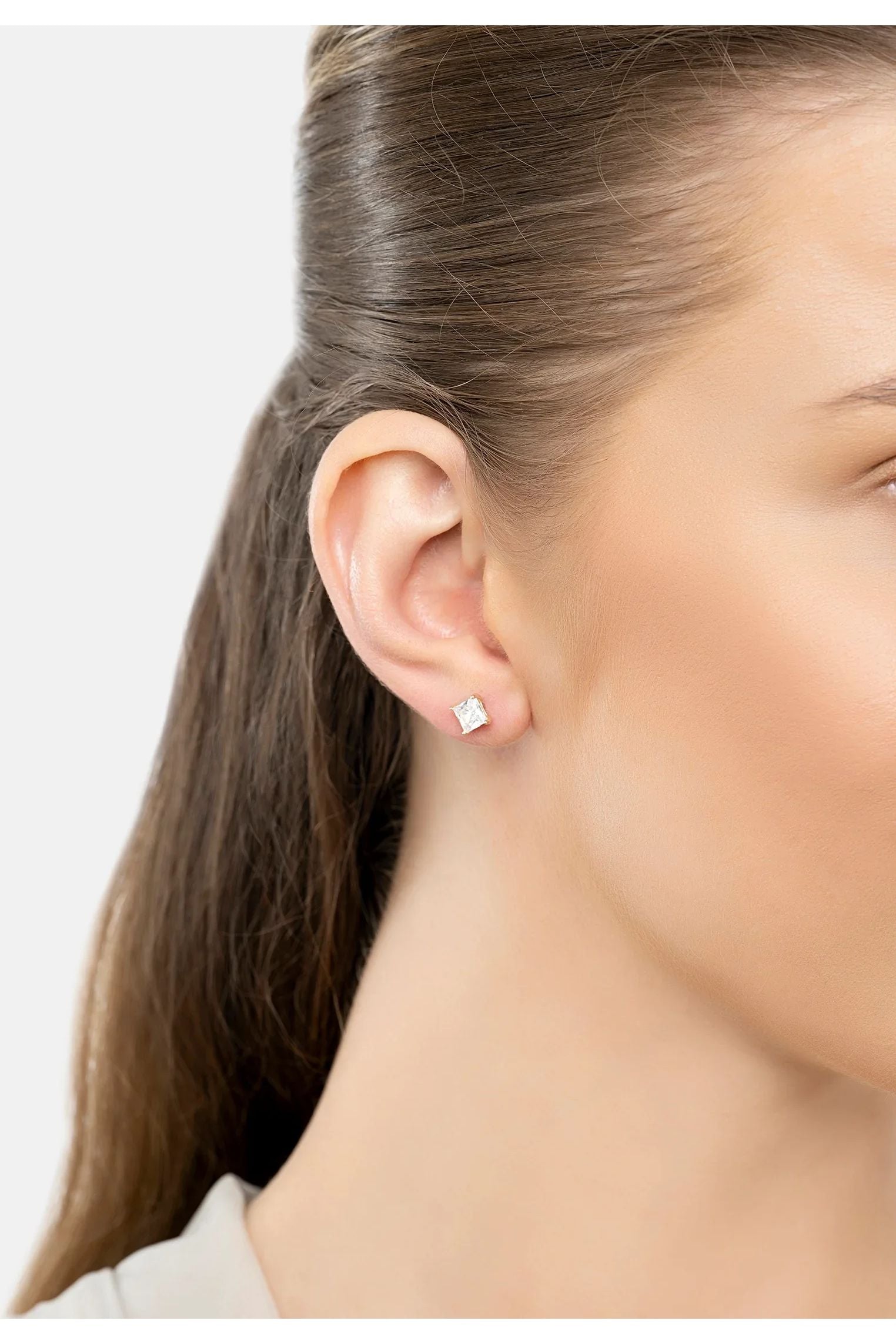 The earring worn by a model.