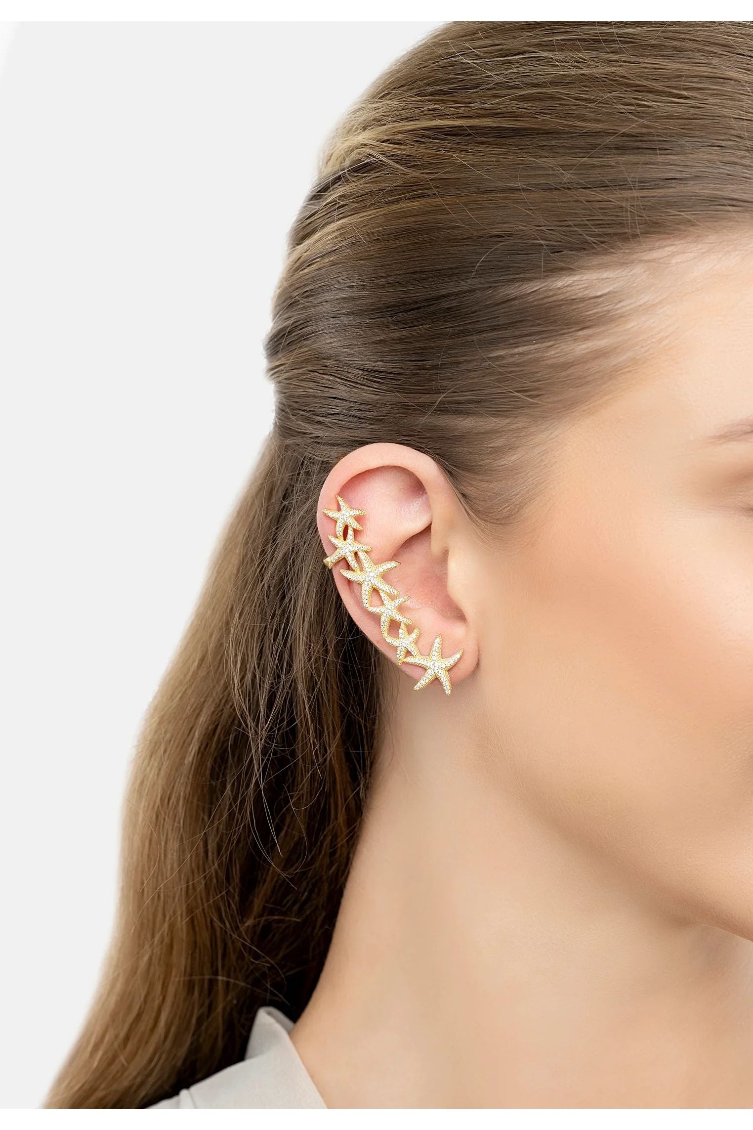 The earring worn by a model.
