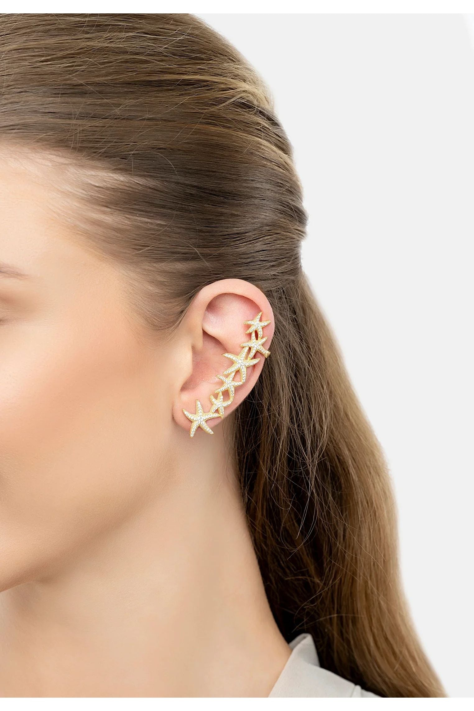 The earring worn by a model.