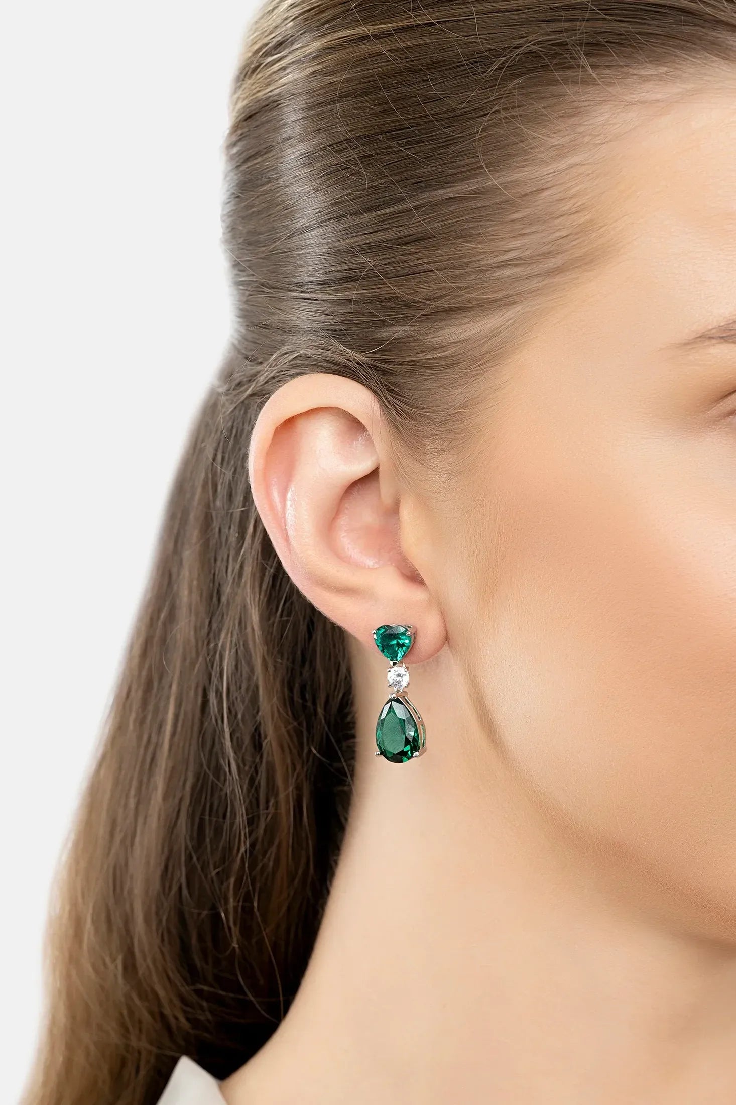 The earring worn by a model.