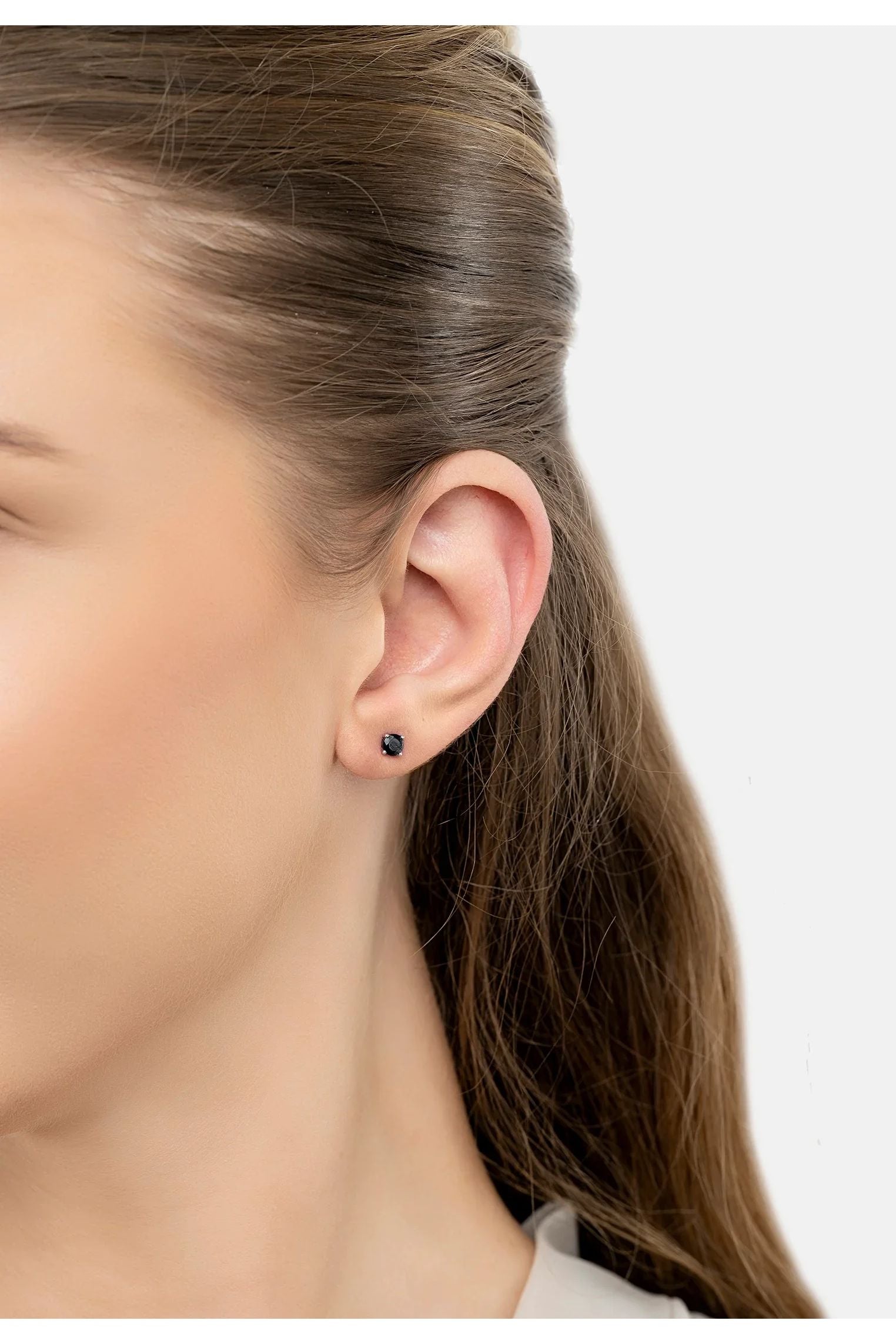 The earring worn by a model.