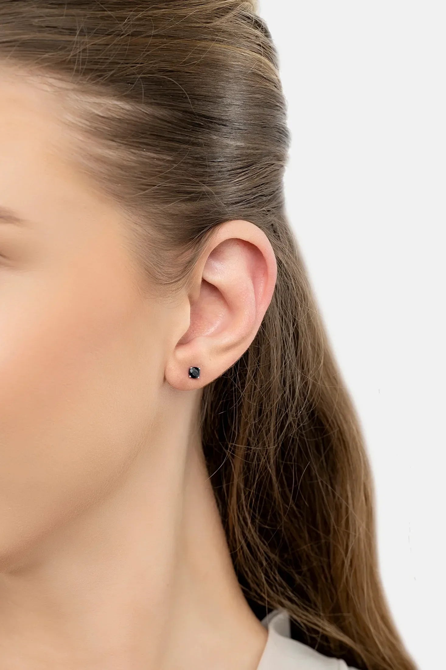 The earring worn by a model.