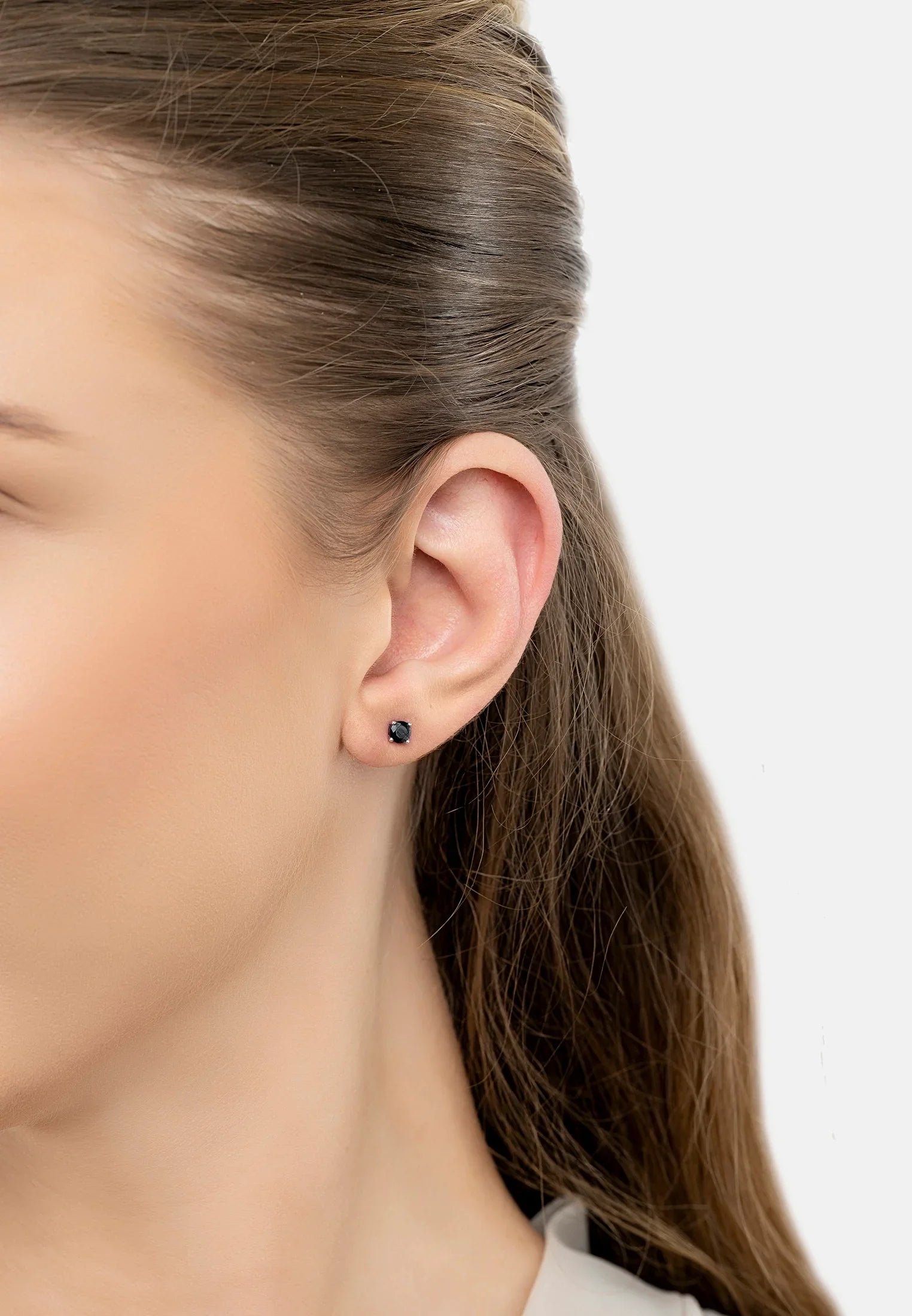 The earring worn by a model.