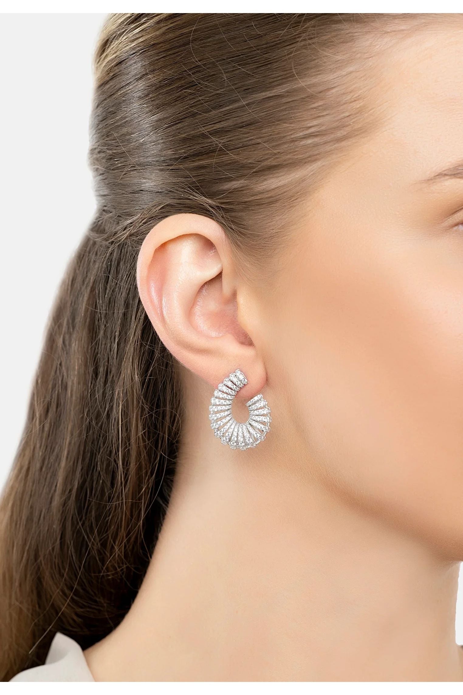 The earring worn by a model.