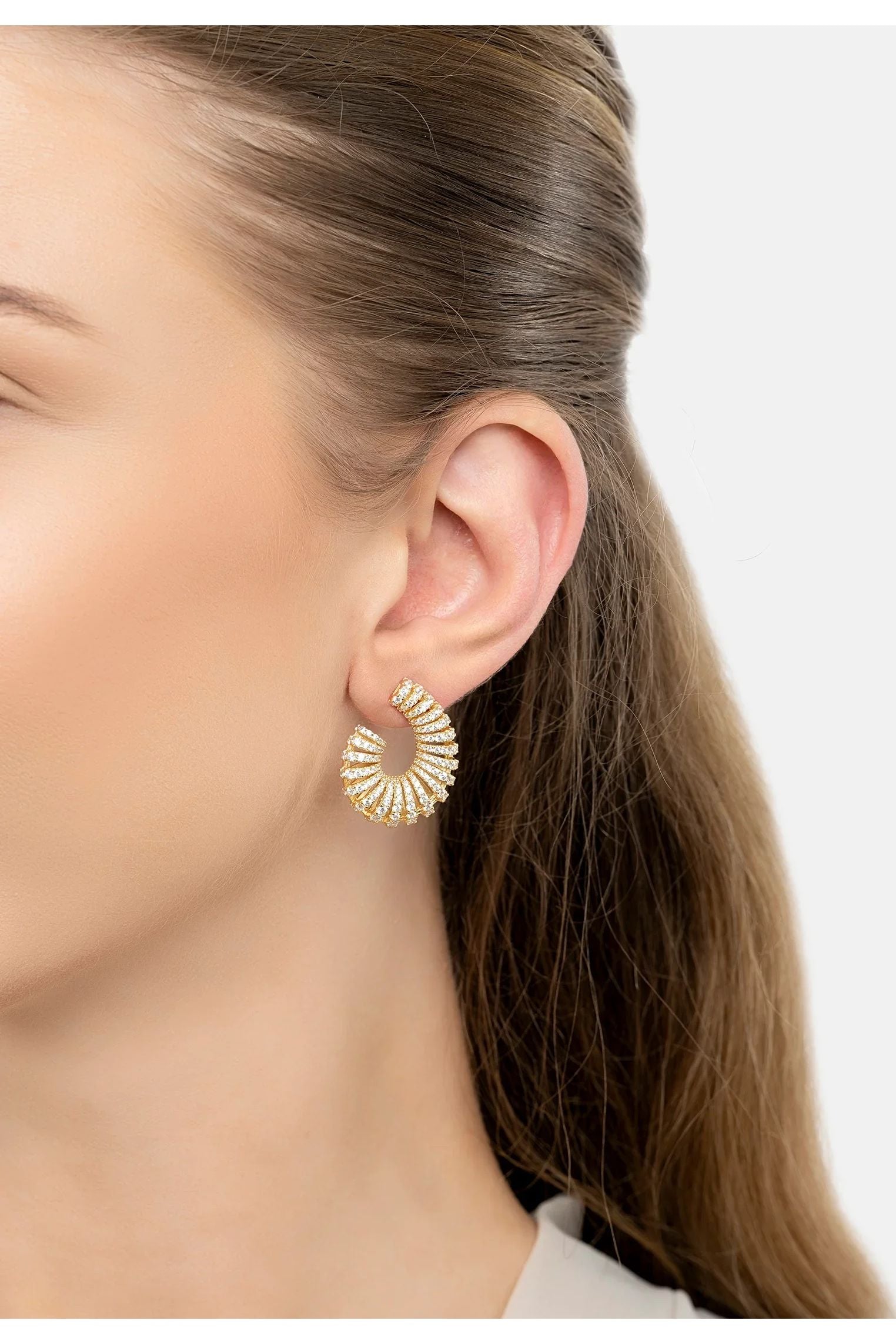 The earring worn by a model.