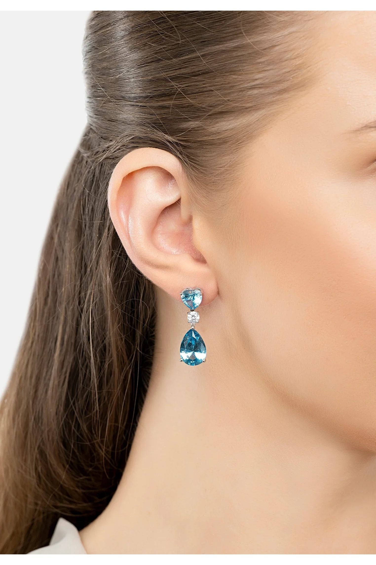 The earring worn by a model.