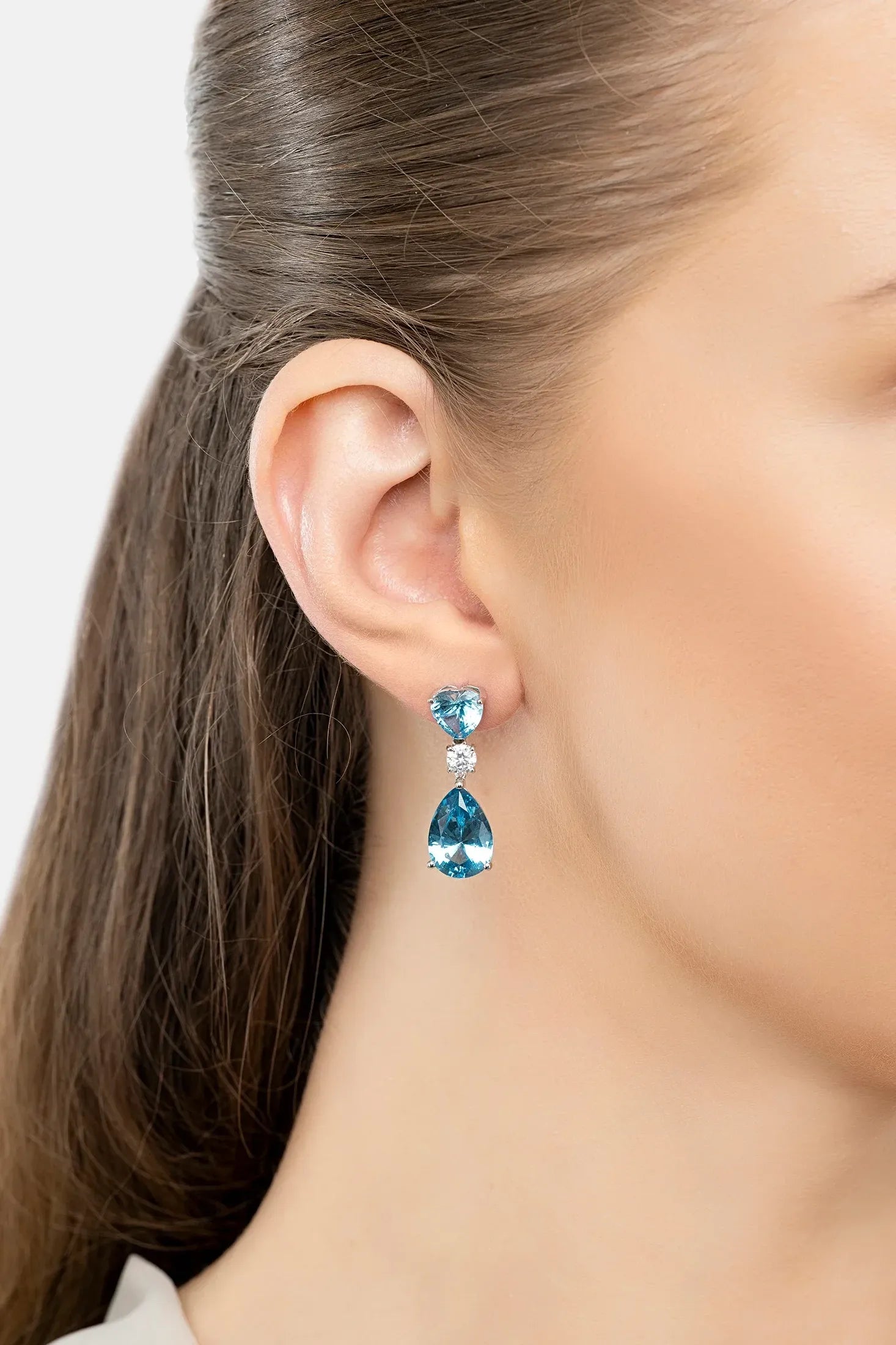 The earring worn by a model.