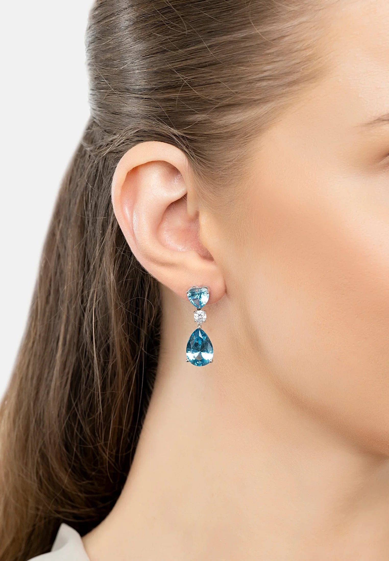 The earring worn by a model.