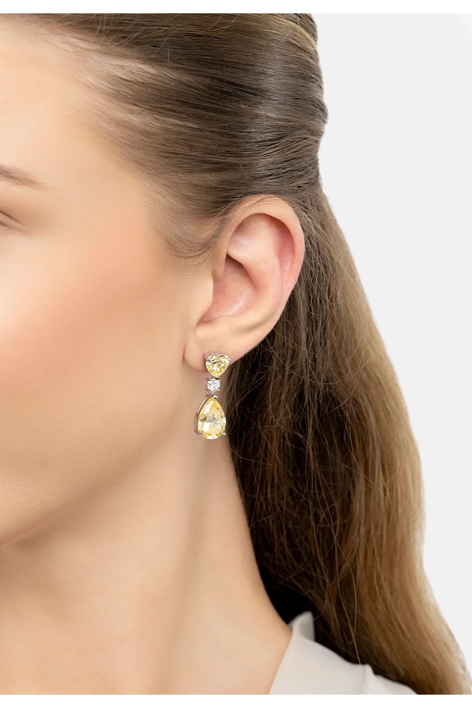 The earring worn by a model.
