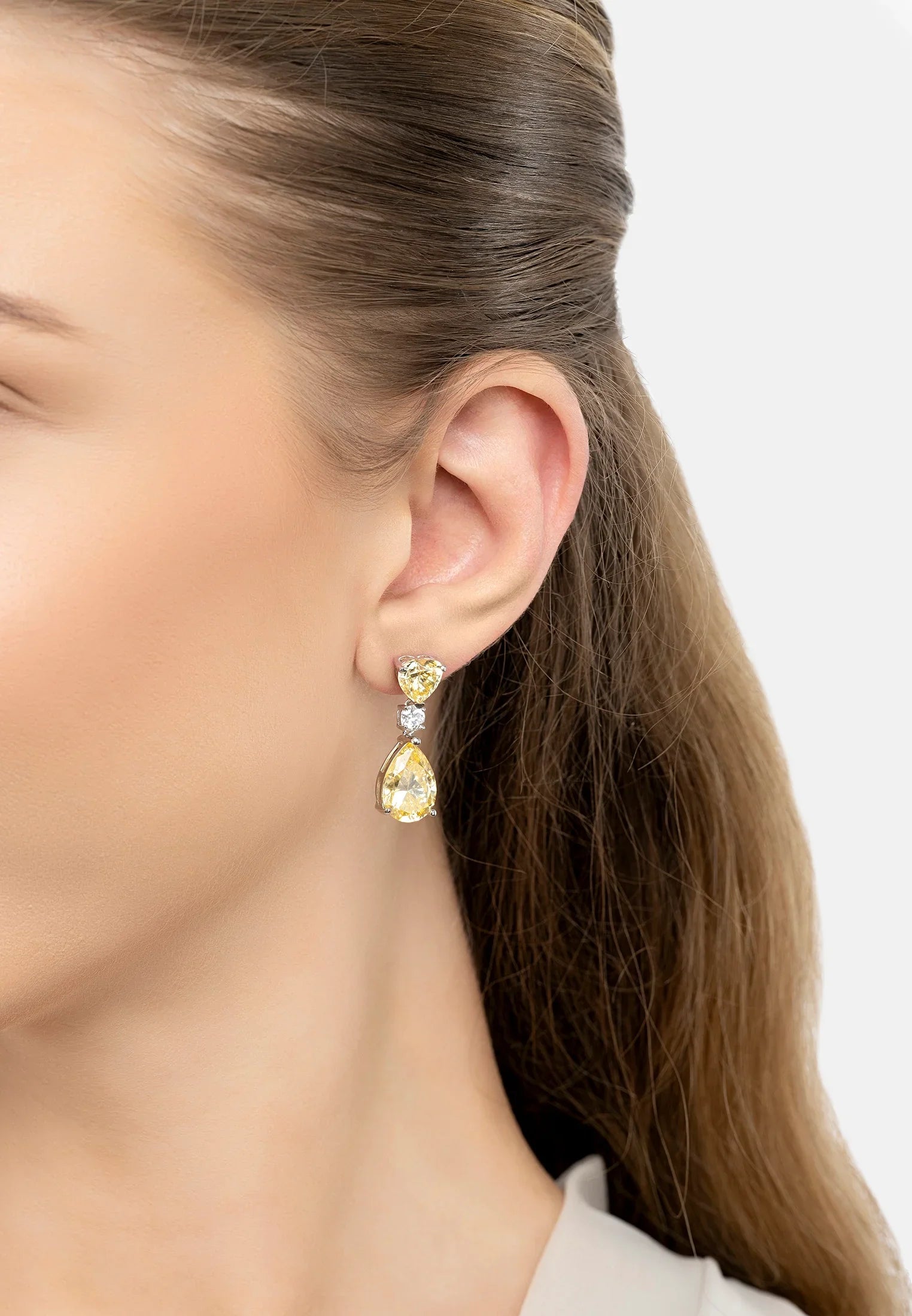 The earring worn by a model.