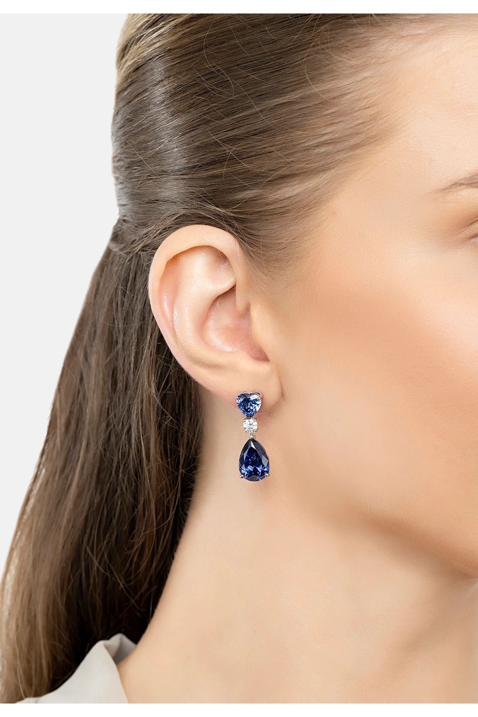 The earring worn by a model.