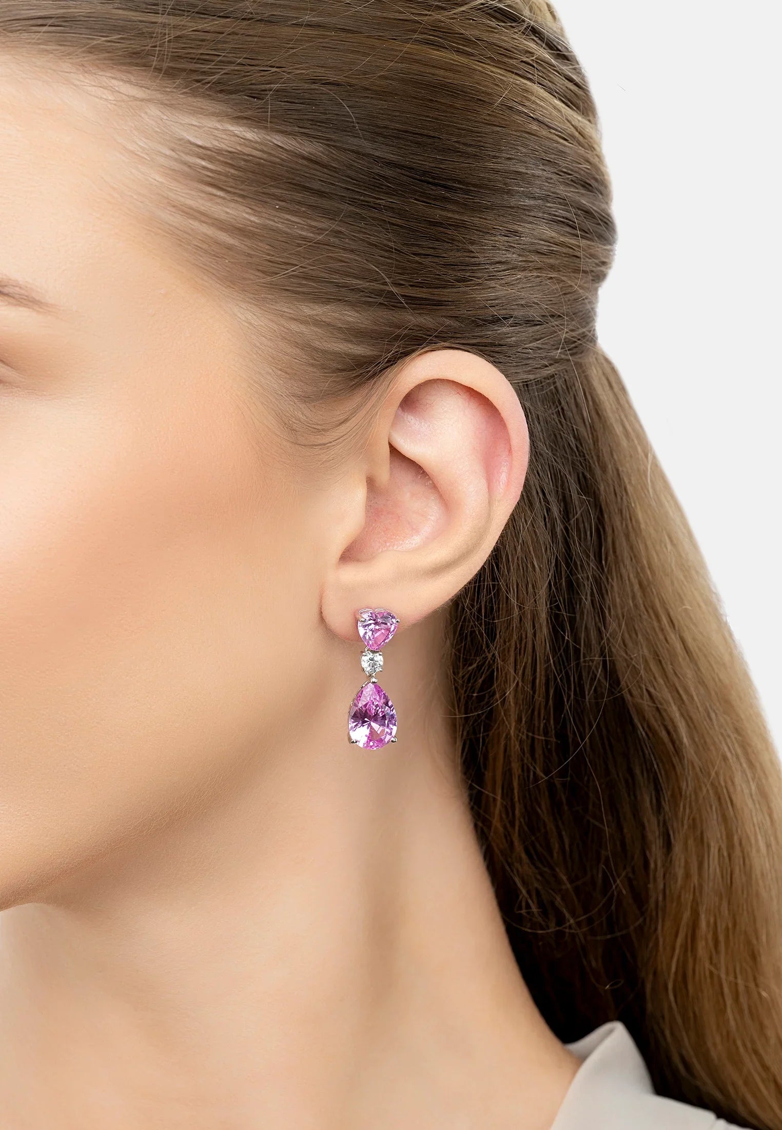 The earring worn by a model.