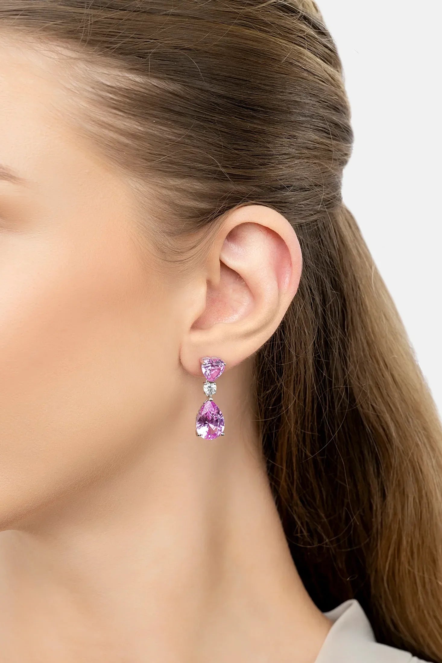 The earring worn by a model.